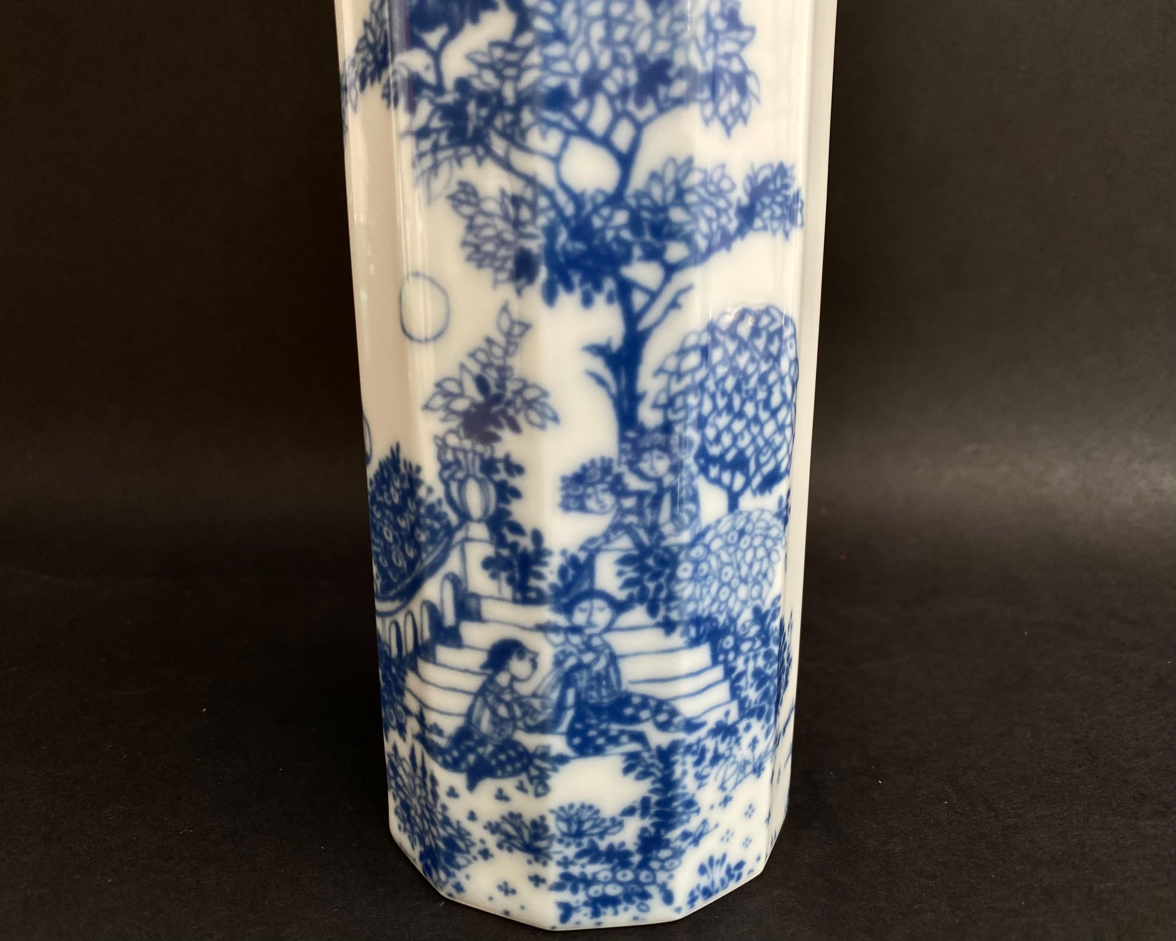 A Rosenthal vase, polygonal shape designed by Tapio Wirkkala and the blue design by Björn Wiinblad.

This vase is from the Studio linie series, the design is called Serenade 70s.

A scene from the blue garden is shown on it.

A very beautiful flower