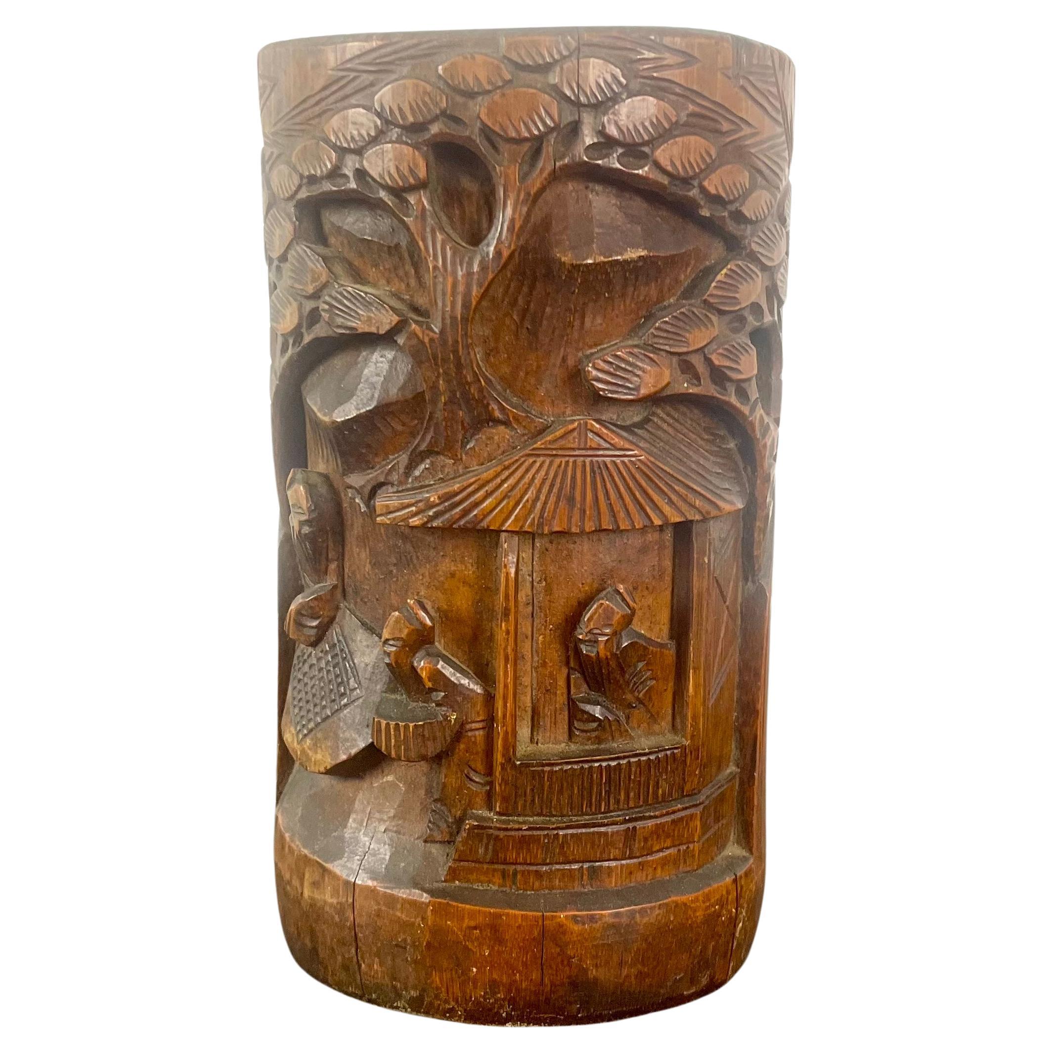 Hand carved bamboo vase/brush pot/bitong.

This hand-carved Chinese bamboo bitong or dried flower vase dates from the late Victorian period, circa 1880.

The bitong, or brush pot, is traditionally carved.
This vase is ideal for decoration with dried