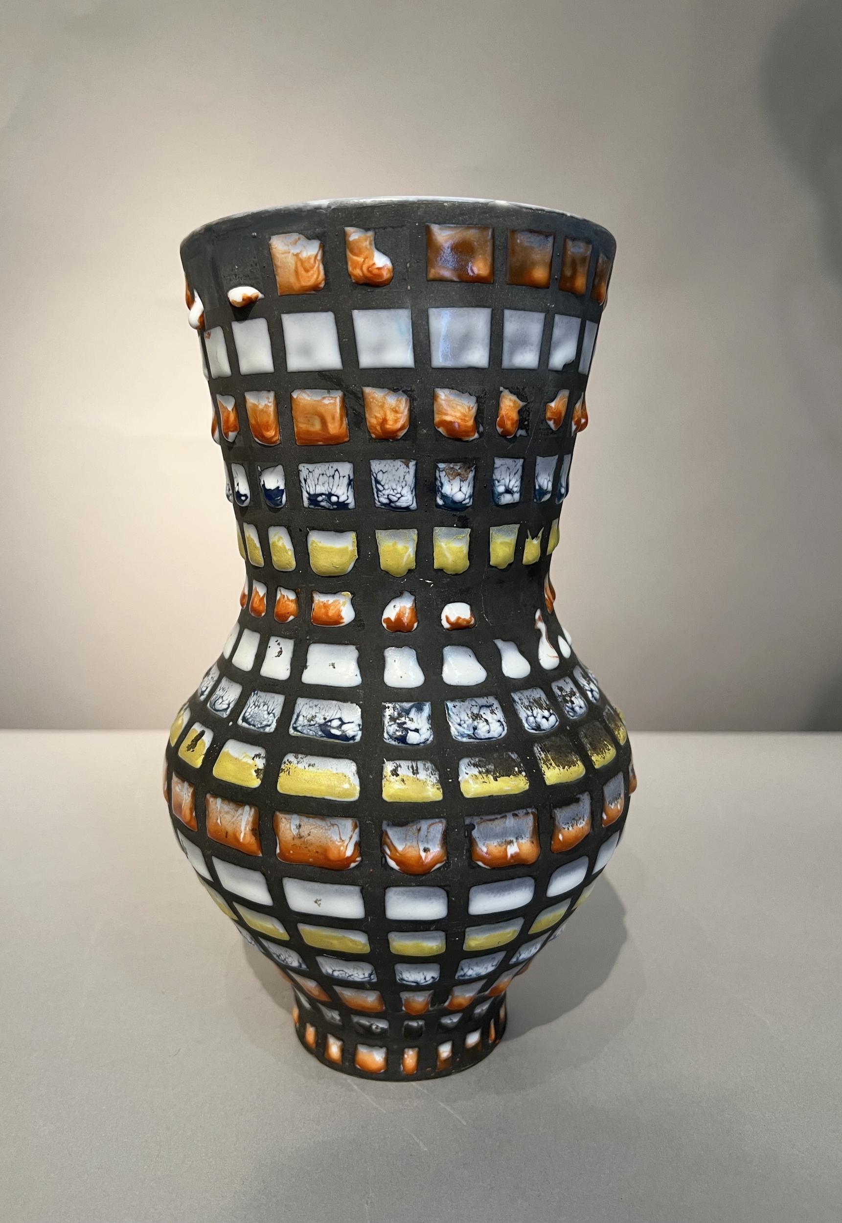 Large baluster-shaped vase with « Pyjama » design in polychrome enameled ceramic. Signed Capron Vallauris.
In perfect condition, but some original enameling defects are visible on the photos.

Roger Capron, France (1922-2006)

Roger Capron, born in