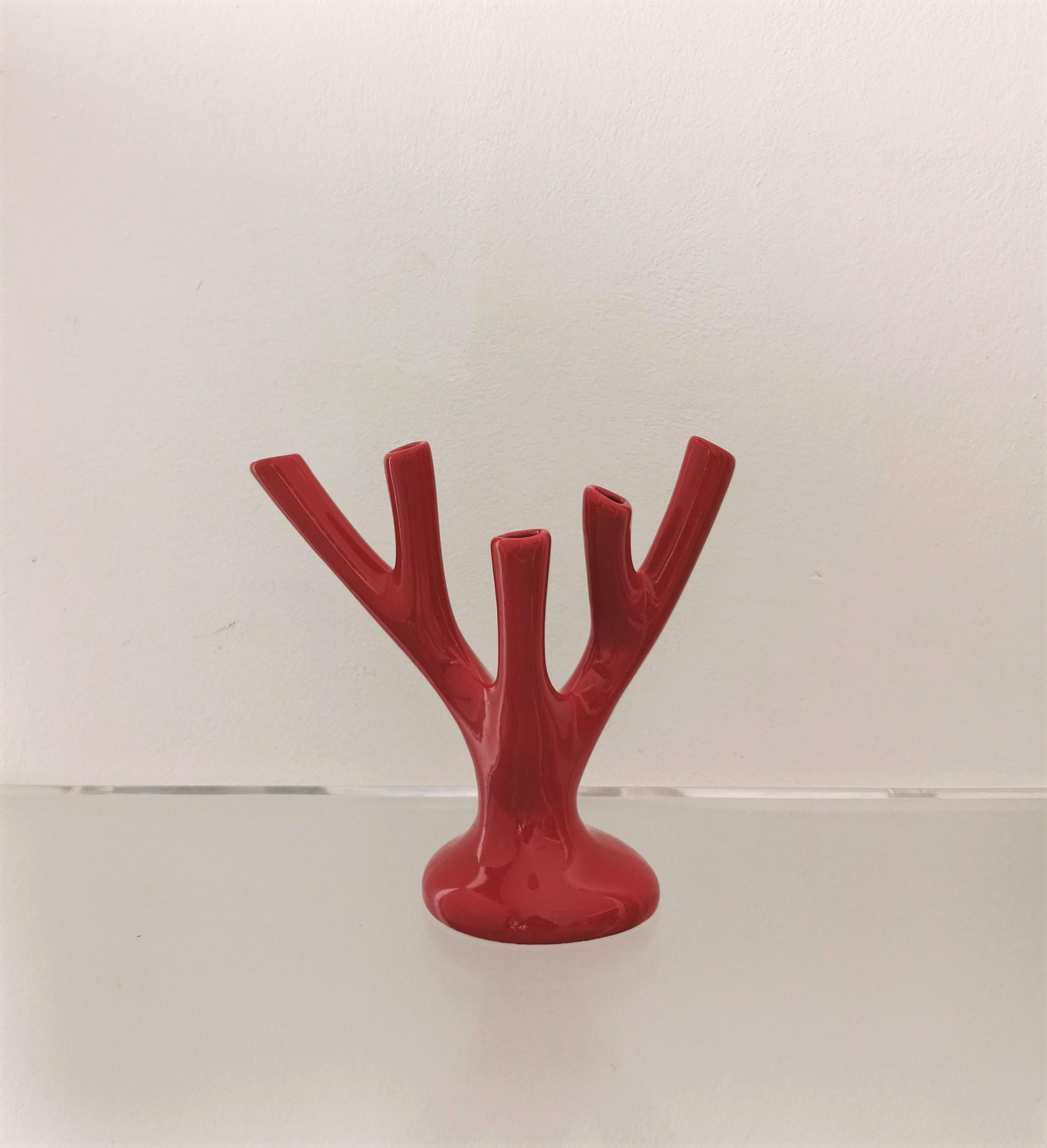 Particular and simpatic sculptural flower holder vase in red glazed ceramic with coral branch body with 5 branches and oval shaped base. Made in Italy in the 70s.