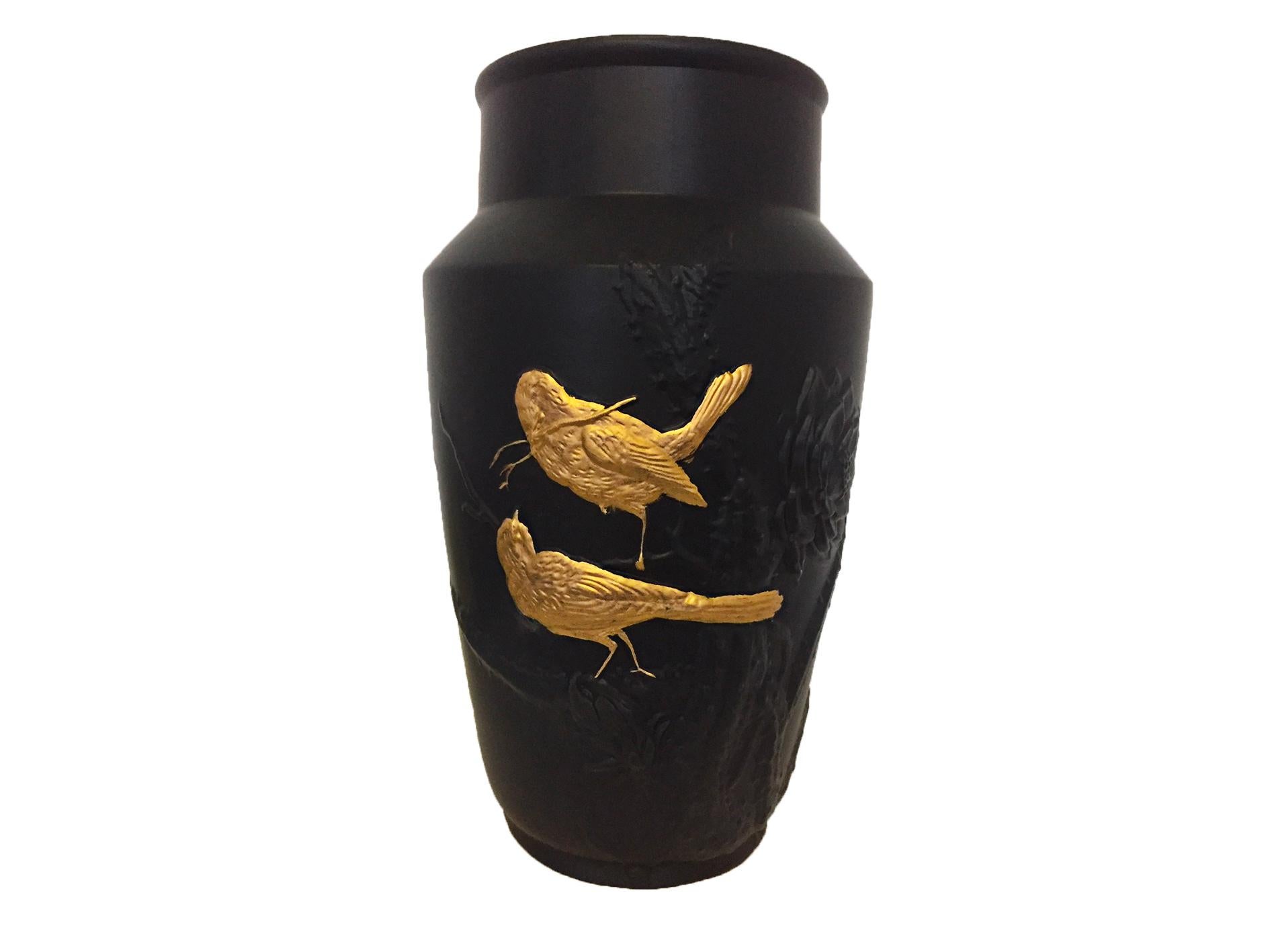 Handmade Tokyo gold Art Nouveau vase, manufactured by one the oldest French ceramic makers in France (open since 1736). 
This stoneware vase is inspired by the themes of Art Nouveau with black flowers and gold birds in relief.
The frost proof