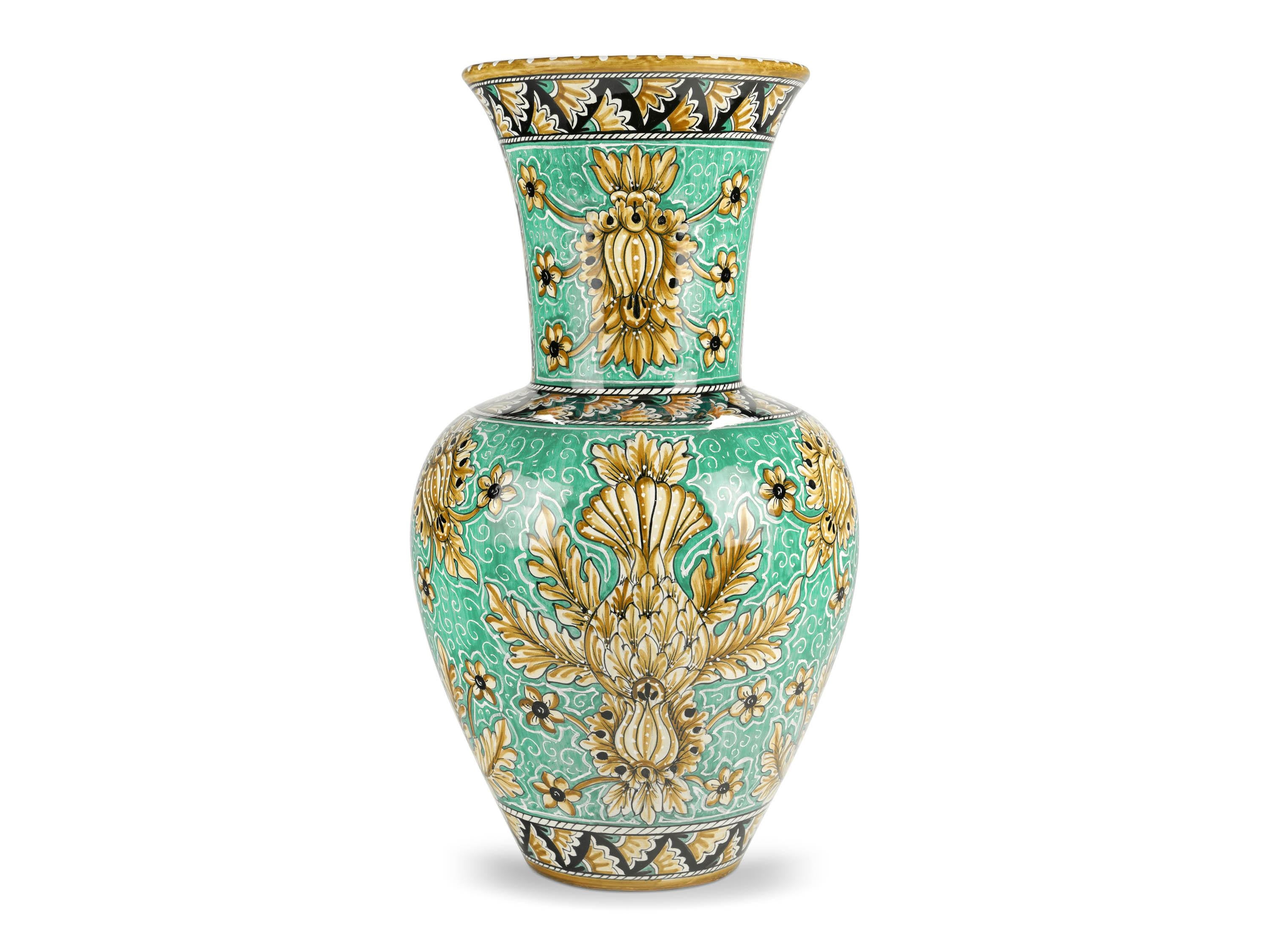 Large majolic vase in green aquamarine color, glazed in polychrome, characterized by the elegant presence of naturalistic ornamental motifs that enhance its forms beautifully. Its powerful aesthetic impact is ensured by the slender neck and by the