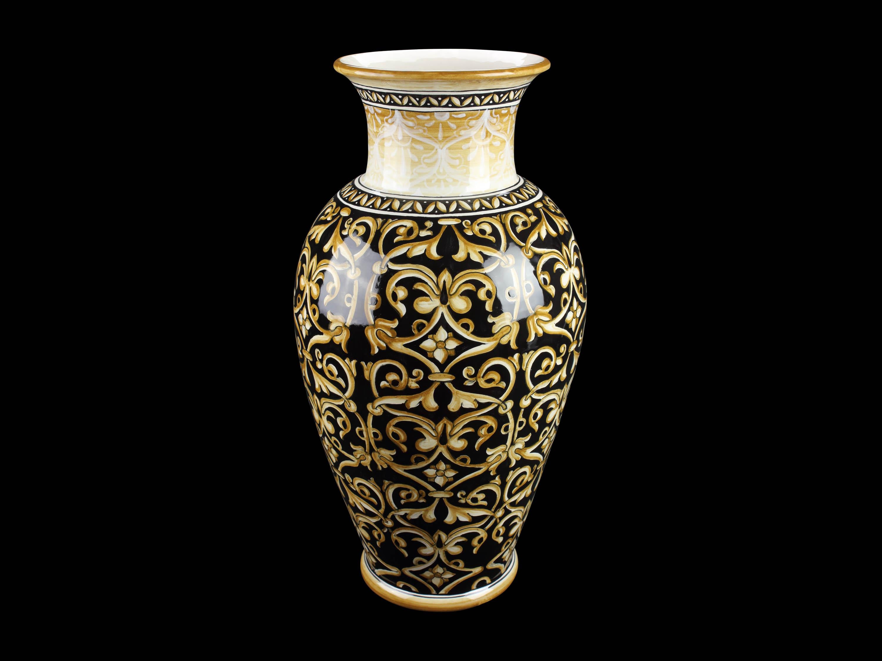 Majolica vase with a black background decorated in golden yellow. the vase is formed by a very slender body and a flared neck ending with a rather everted edge: it is handmade and hand-painted in Italy, following the original Renaissance painting