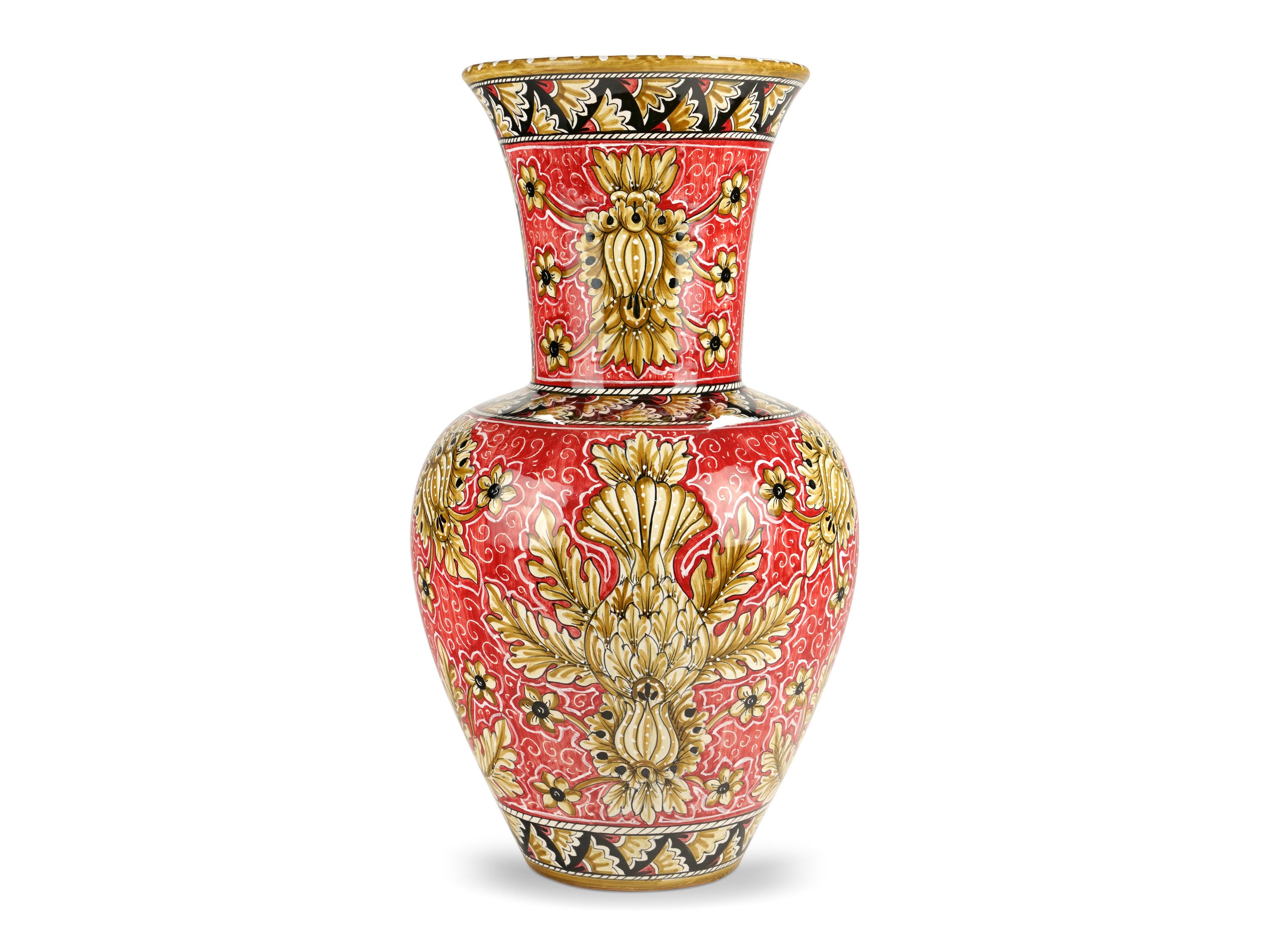 This lavish majolica vase is painted in polychrome, characterized by the elegant presence of naturalistic ornamental motifs that enhance its forms beautifully. Its powerful aesthetic impact is ensured by the slender neck and by the hand-painted