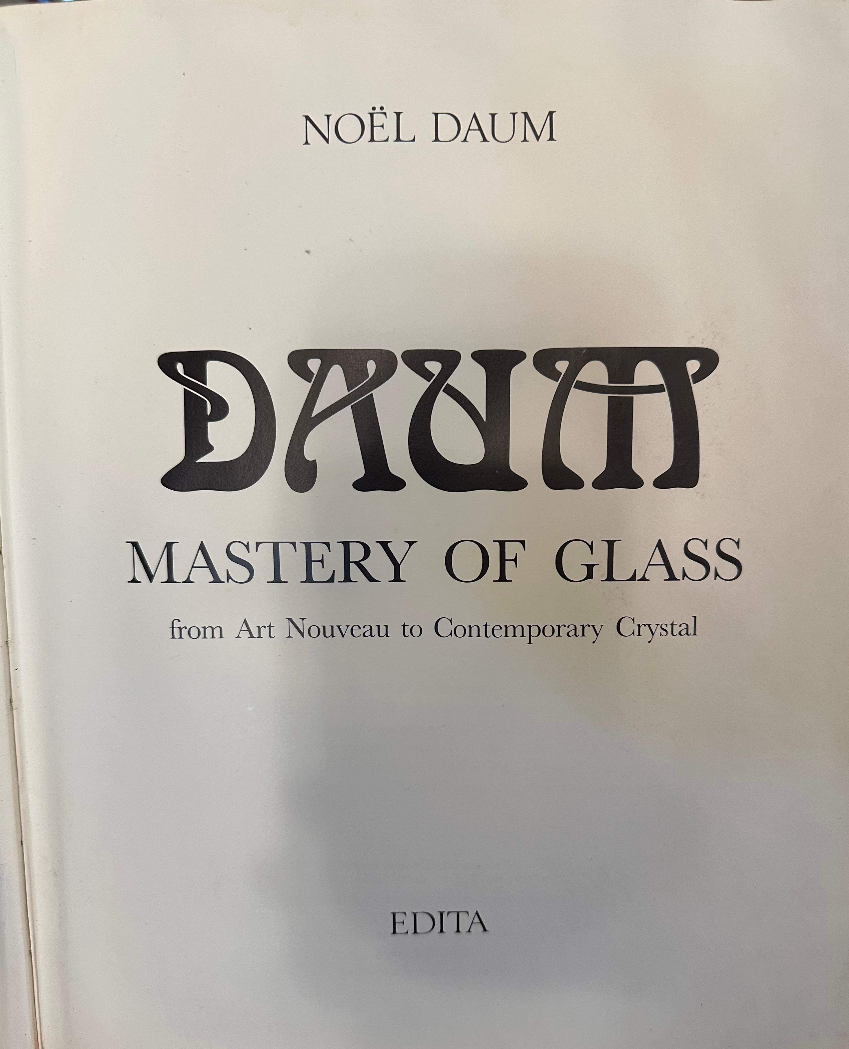 Sign: Daum Nancy 
glass with applications
Daum is the name of a factory established in 1875 in the city of Nancy, France. When the notary Jean Daum became the owner of an industrial furnace, that of Nancy Glass, to expropriate the owners who were