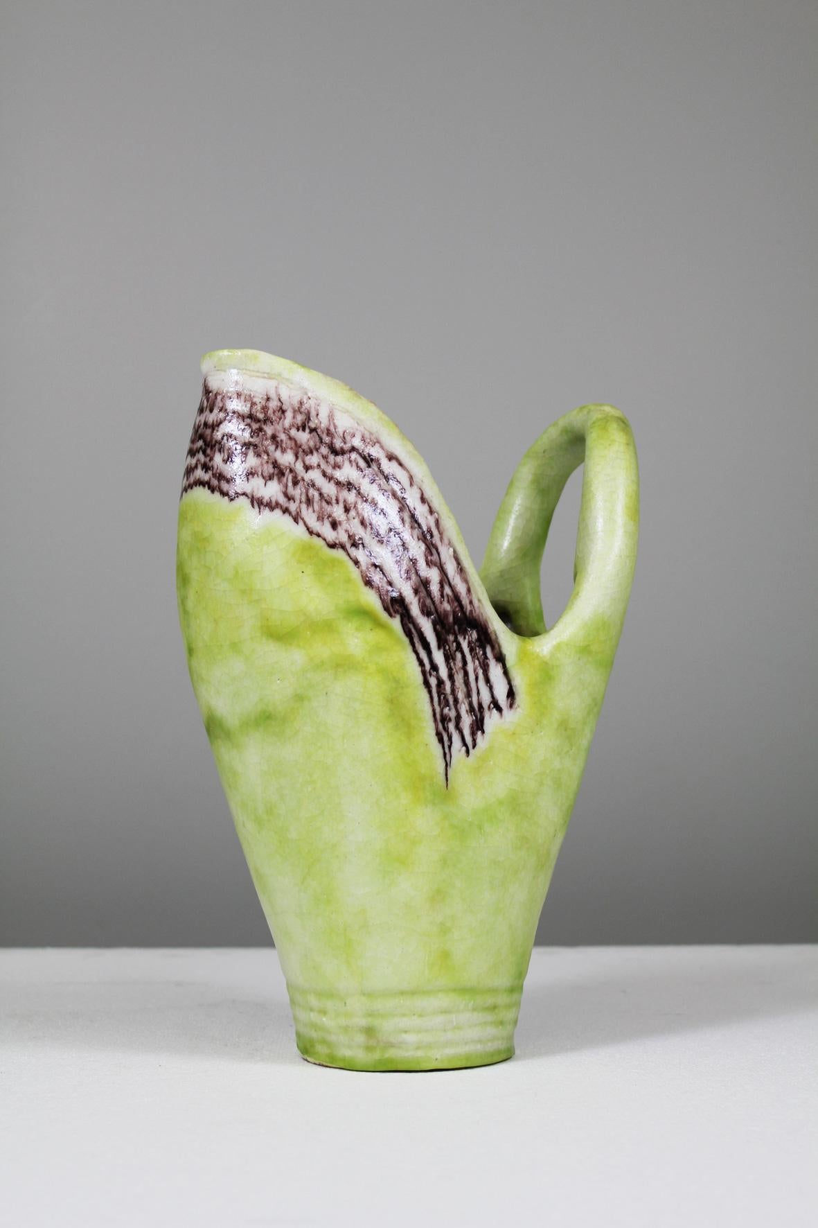 This opulent and very rare vase is made of ceramic with a green and brown glaze.
Unique piece by Guido Gambone, 1950.