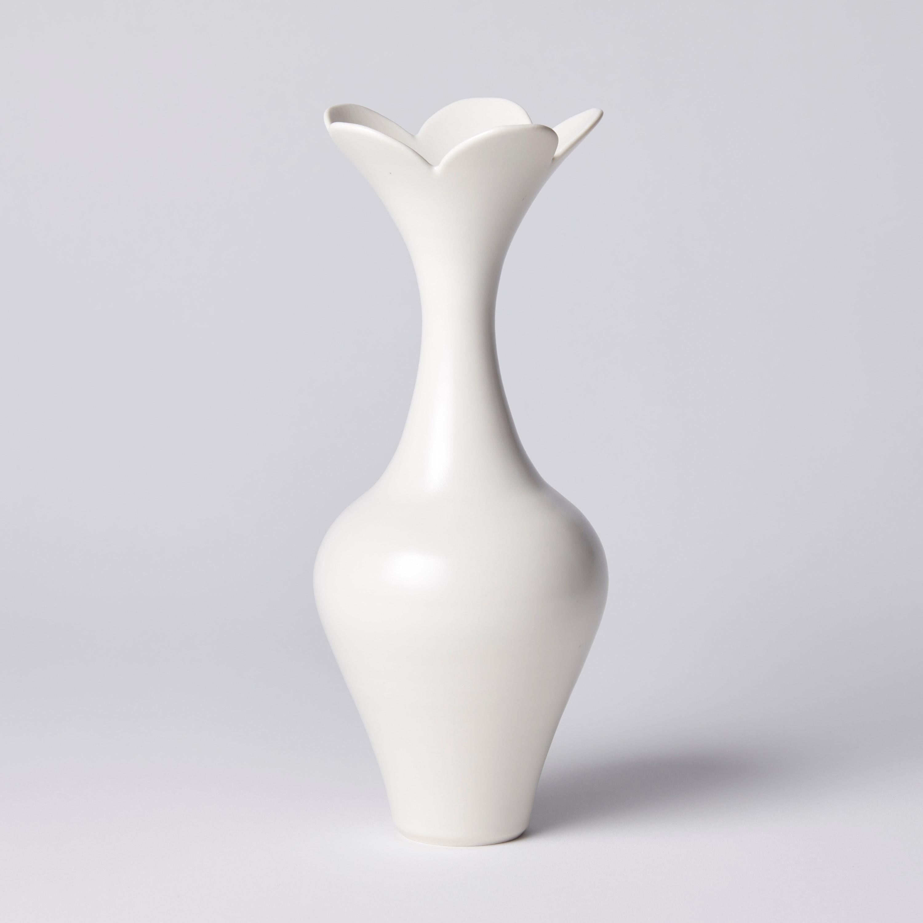 ‘Vase with Petal Rim' is a unique porcelain sculptural vessel by the British artist, Vivienne Foley. 

Vivienne Foley is based in Gloucestershire where she produces exquisite ceramic sculpture. Although in essence they are often functional pieces