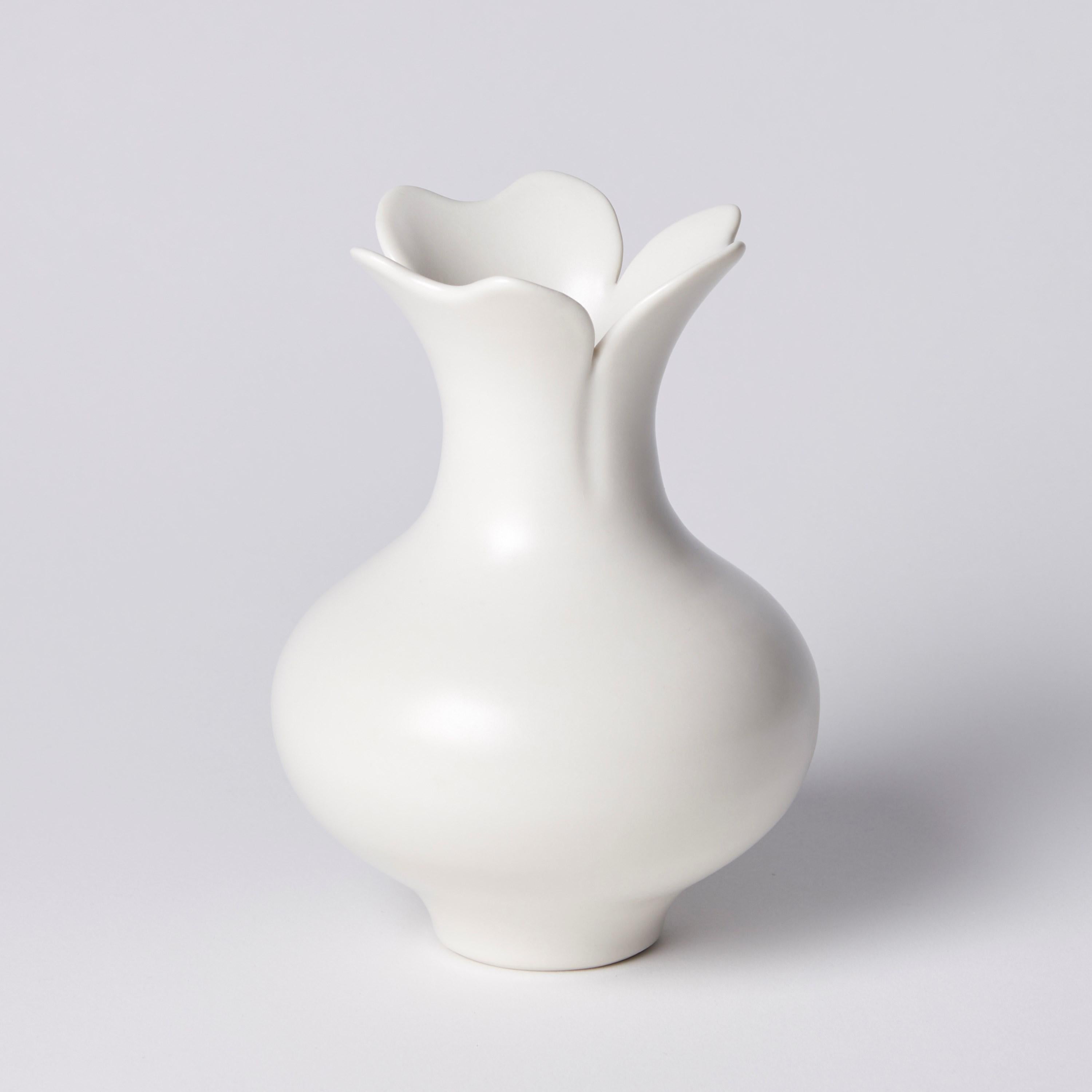 ‘Vase with Three Petal Rim' is a unique porcelain sculptural vessel by the British artist, Vivienne Foley. 

Vivienne Foley is based in Gloucestershire where she produces exquisite ceramic sculpture. Although in essence they are often functional