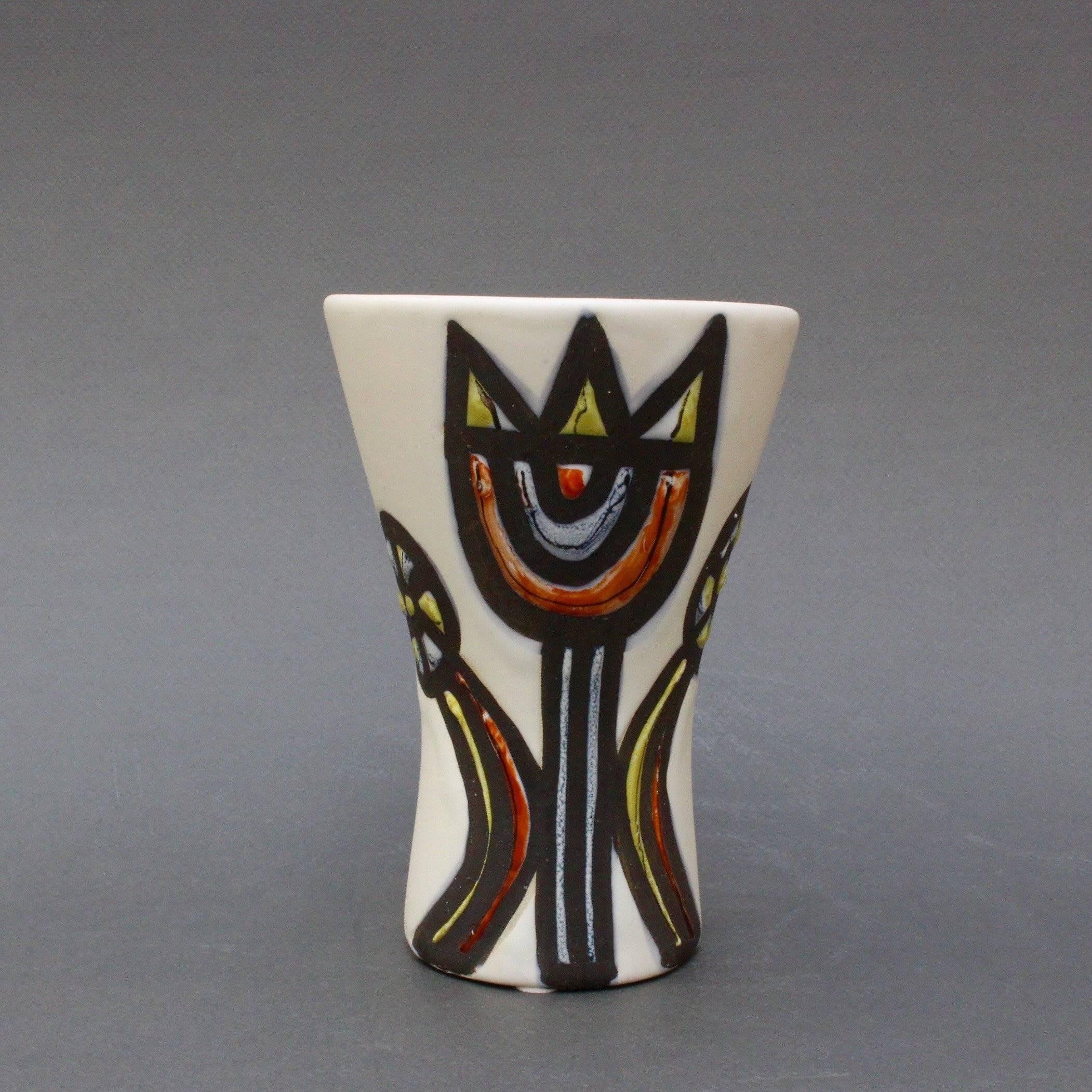 A gorgeous vase with tulips (1950s) by ceramicist Roger Capron (1922 - 2006) who founded the craft-based workshop in Vallauris, France, l'Atelier Callis, where his creations contributed to a veritable renaissance of pottery and ceramics. Capron left