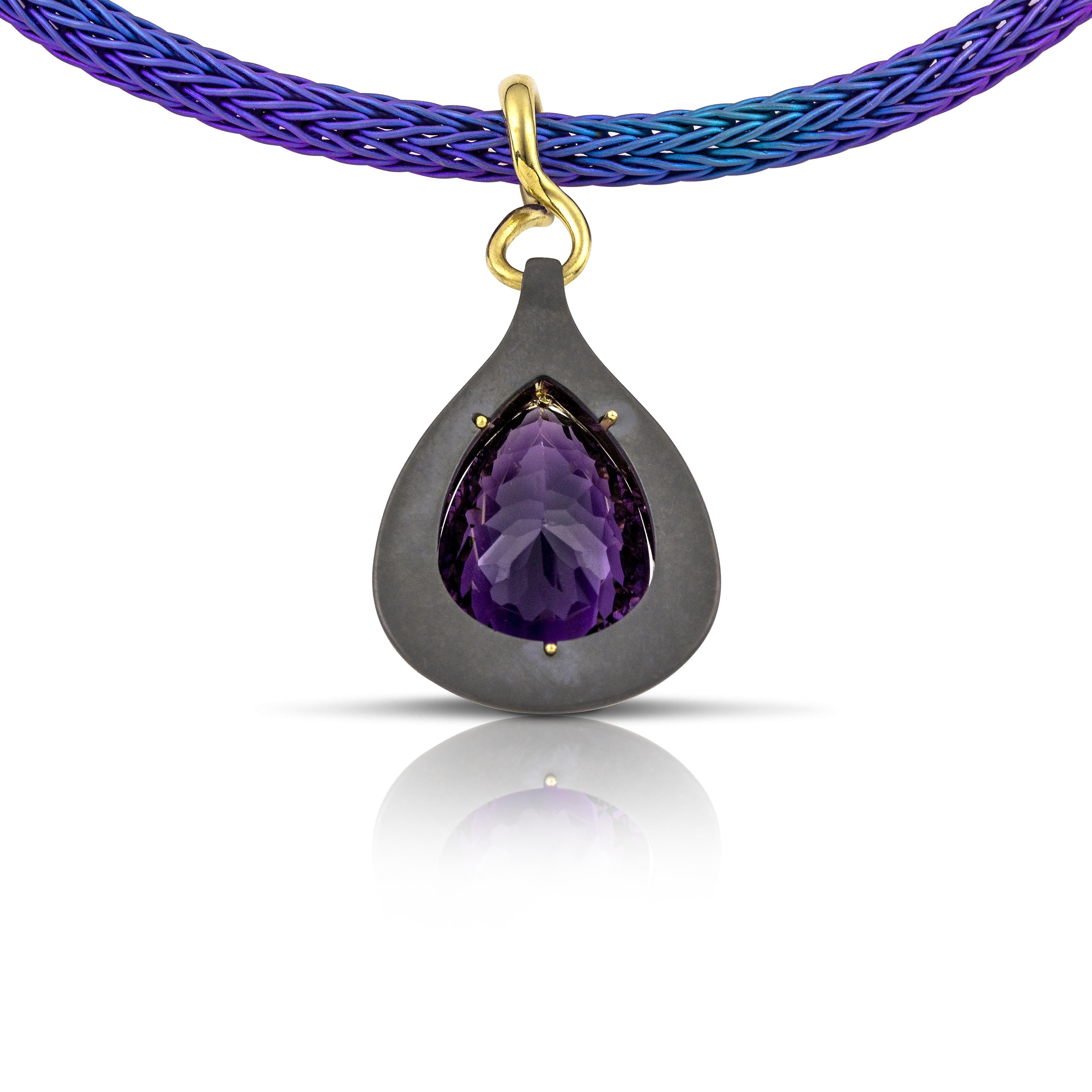 Drop Amethyst Necklace by Vasilis Giampouras at Second Petale Gallery
At the heart of this masterpiece lies a mesmerizing drop amethyst, surrounded delicately within a halo of gleaming 18k gold and a durable pure titanium bezel. The rich purple hues