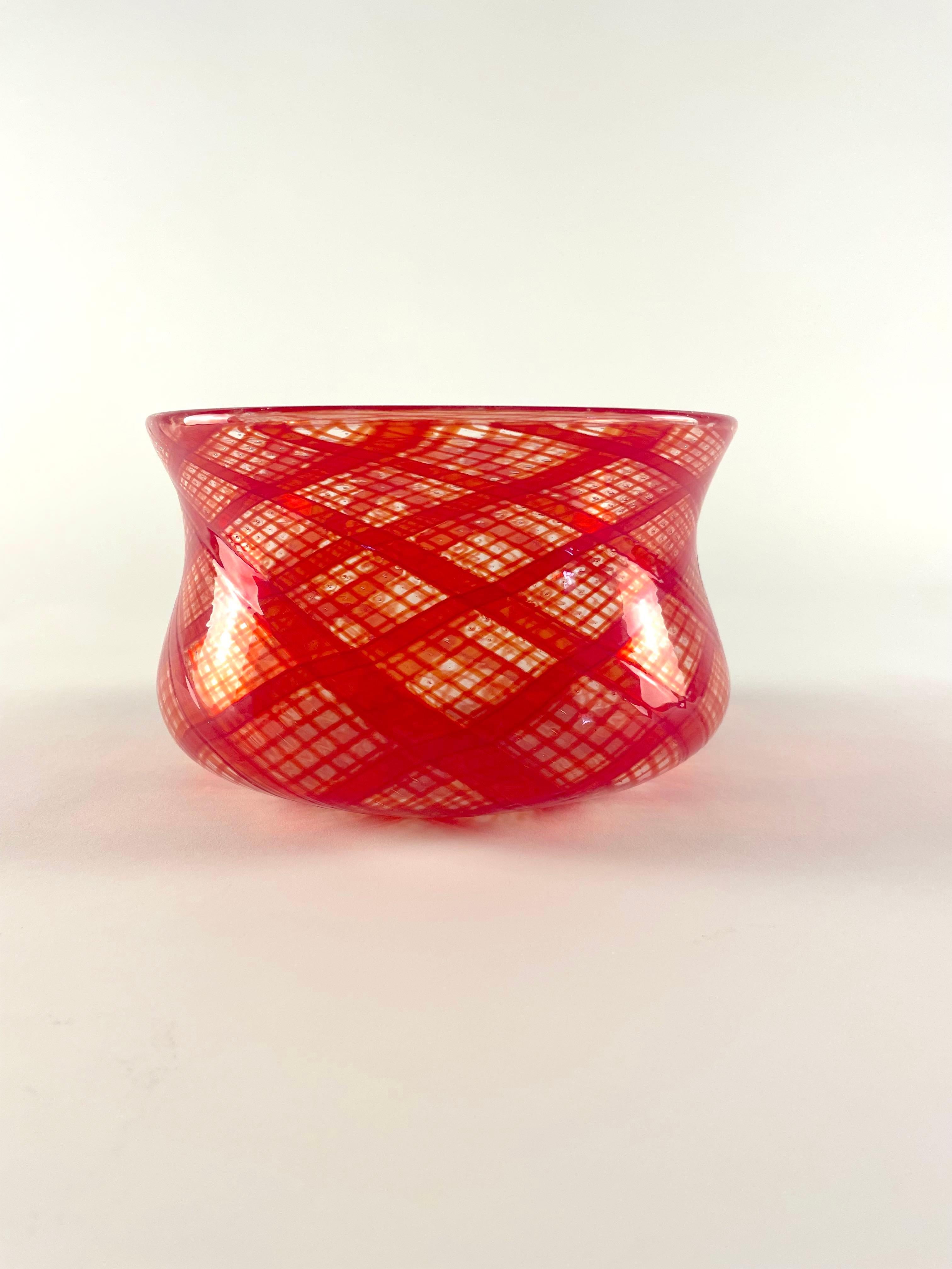 This vessel is a Murano glass masterpiece realized by maestro Bruno Fornasier for Fratelli Toso glass factory. It is realized by using a complicated technique which requires great manufacturer skills. The technique you is called 