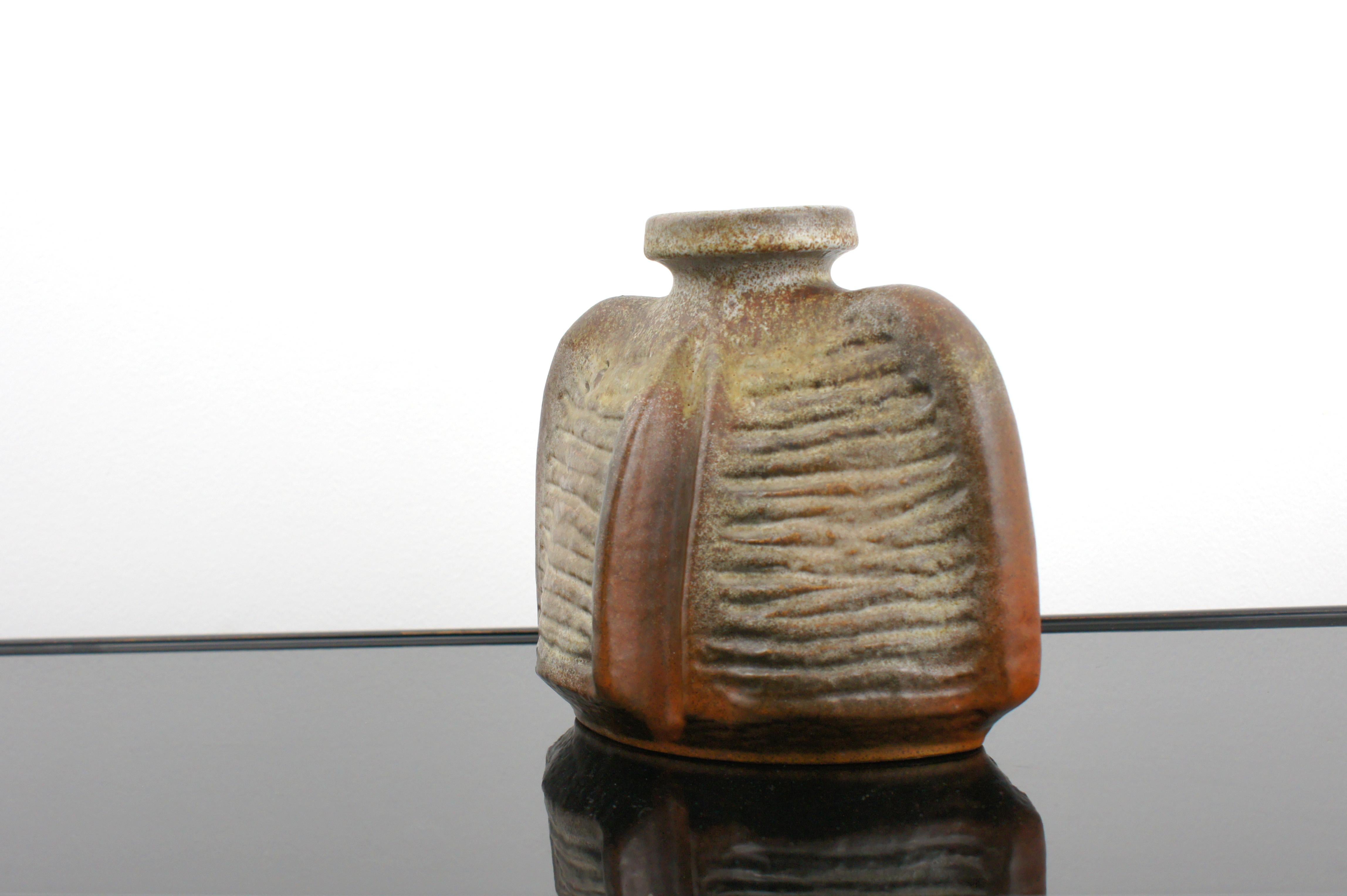 German-made 'fat lava' vase from the 1960s. 
Designed by Rudolf Christmann for Carstens Tonnieshof.

Manufacturer and series identifier stamped on the bottom.

Perfect condition, collectible