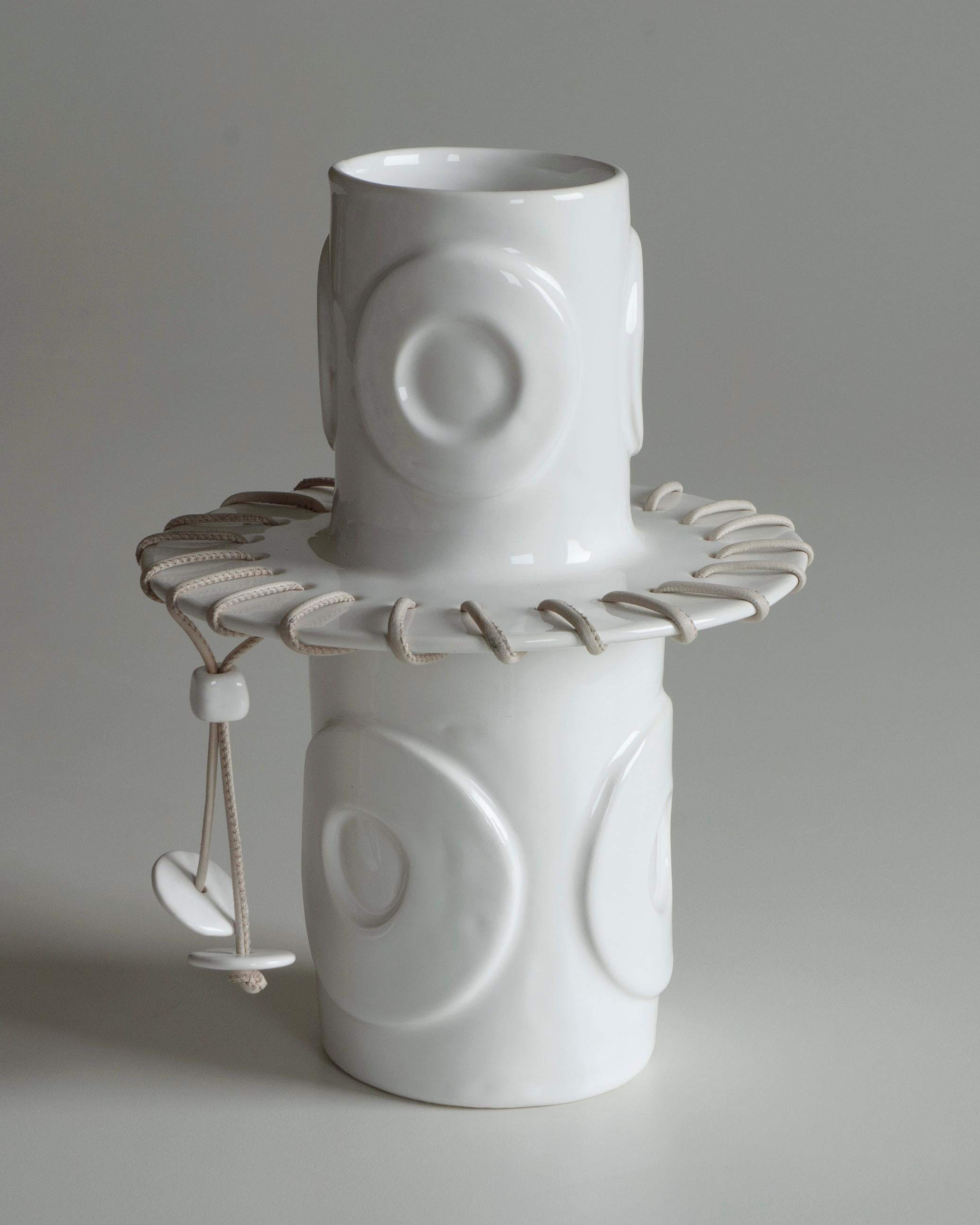 Italian White ceramic vase decorated in relief with leather cord. For Sale