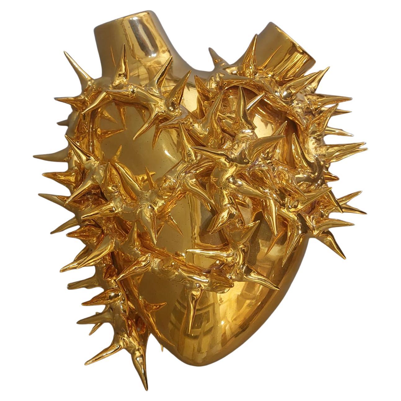 Golden ceramic vase with heart-shaped design For Sale