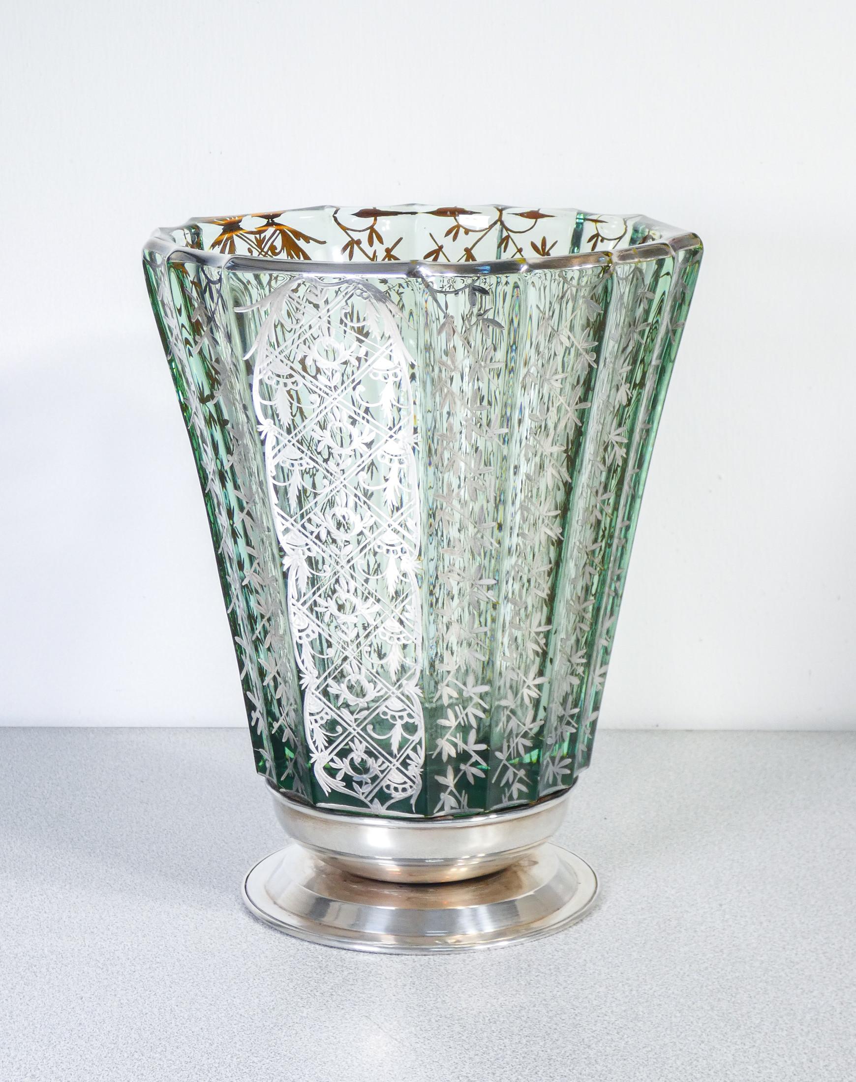 Blown glass vase
with silver decorations.

ORIGIN
Italy

PERIOD
Early twentieth century

MATERIALS
Blown glass and silver

DIMENSIONS
Ø 22 cm
H 27 cm

CONDITIONS
Excellent. No cracks or chipping. Evaluate through the attached photos.

SHIPPING
Free