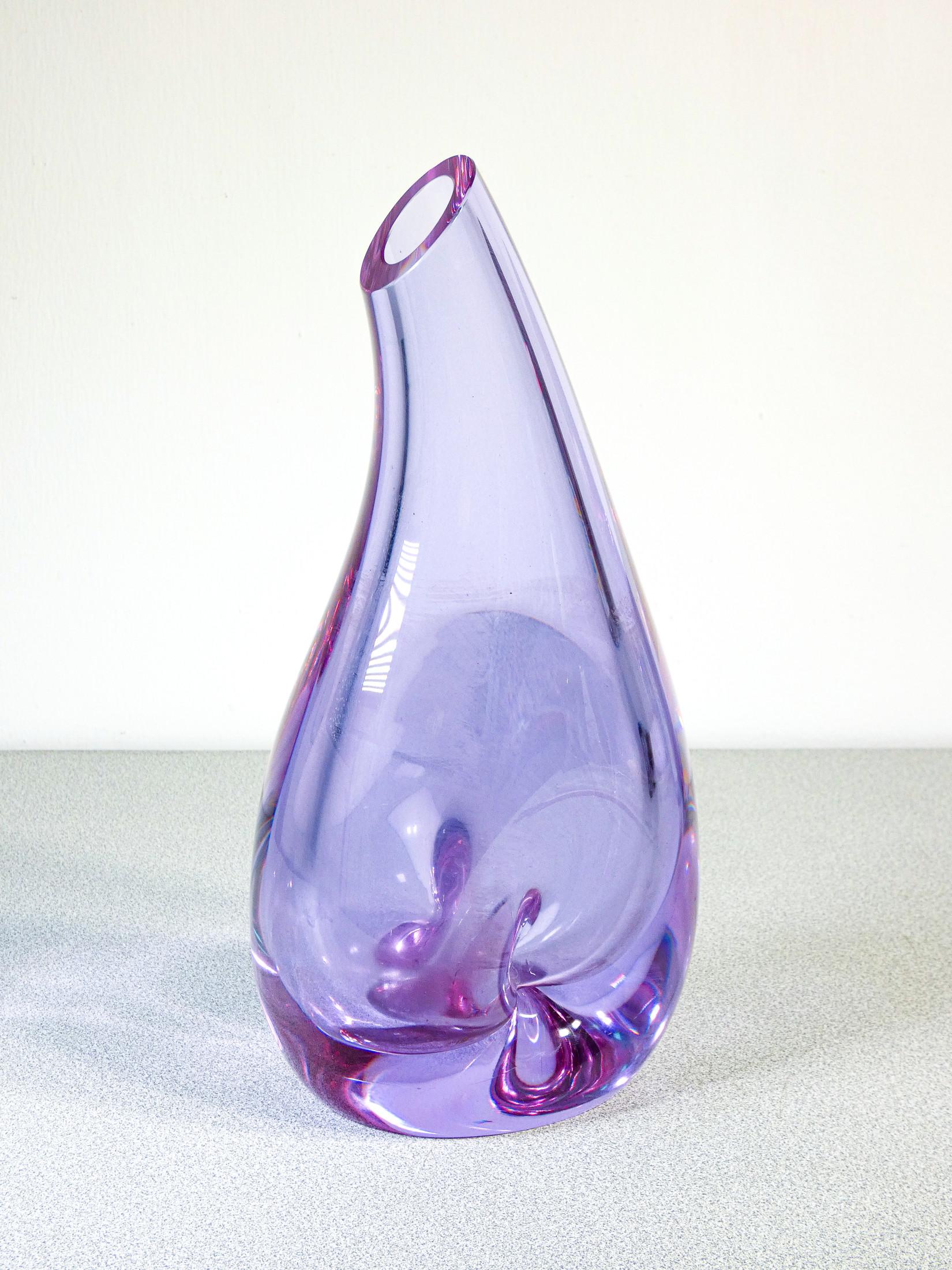 Blown glass vase
by SEVRES.
Coloration varies
appreciably to
depending on the light,
from light blue to violet.

ORIGIN
France

PERIOD
Anni 80

MARK
SEVRES
(signed on the bottom)

MATERIALS
Blown glass

DIMENSIONS
Height : 30cm
Width: 14.5cm
Depth:-