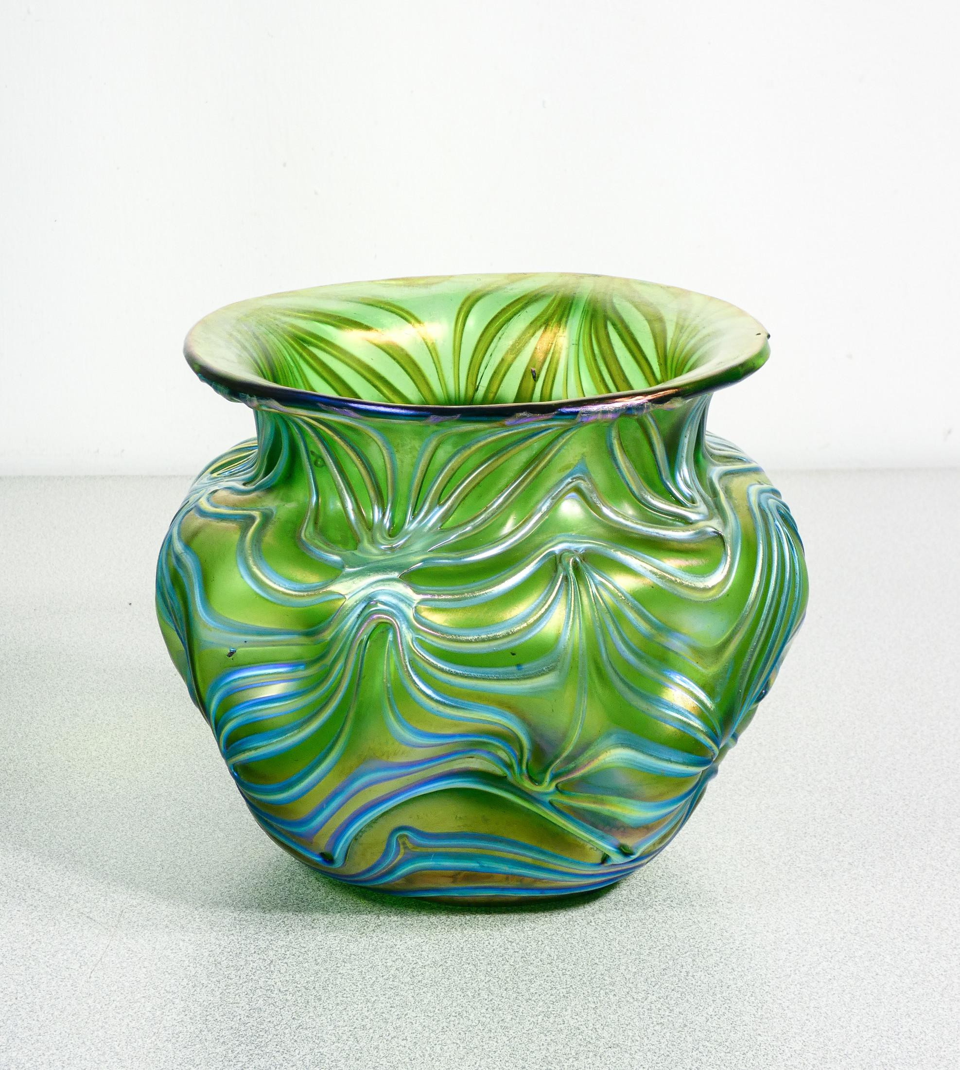 Vase made of glass
blown iridescent
LOETZ Formosa.

ORIGIN
Klostermühle

PERIOD
1902

MARK
LOETZ
one of the most celebrated art glass factories in history, famous for its Art Nouveau-style glass, characterized by iridescent colors and organic