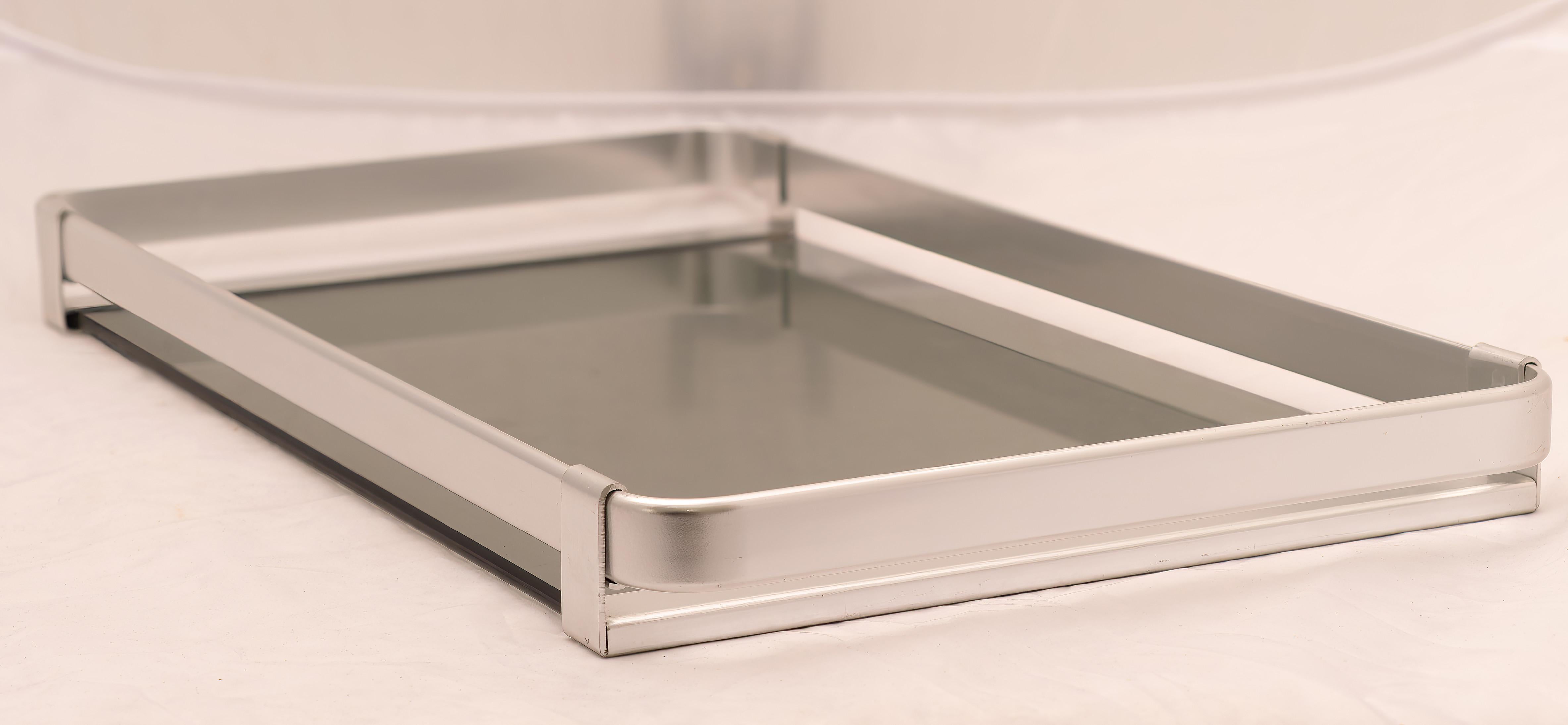 Steel and smoked glass tray, Design Mb Italy, 1960s/'70s. 
Rectangular steel and smoked glass tray Design Mb Italy, 1960s/'70s. 
The price of shipping is for the Italian territory, for the islands and for shipping abroad quote on request. 
Customs