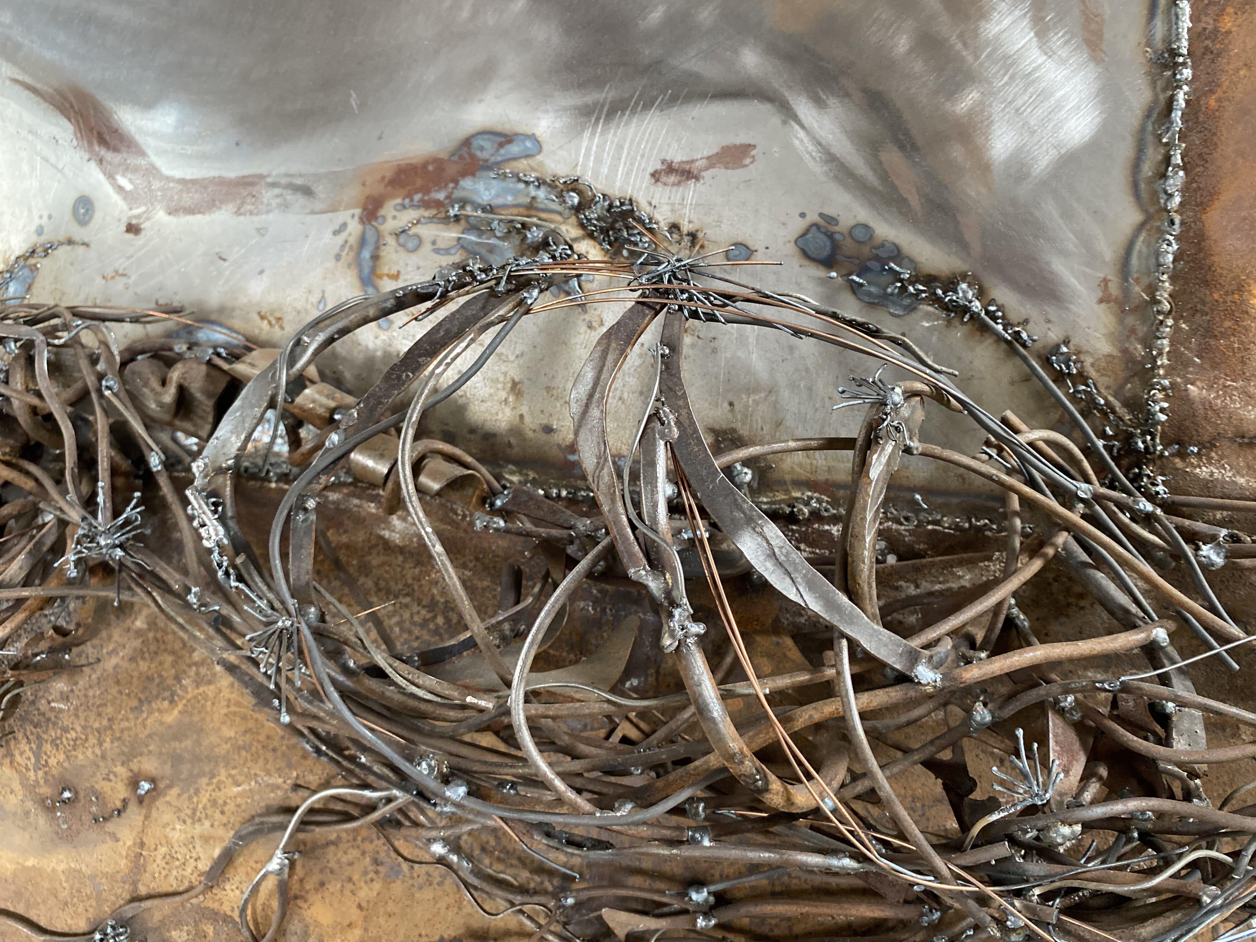 Element, landscape, sunset, mountains, aerial perspective. It is like hills that disappear into the distance illuminated by the morning sun. Made by hand molding of living metal, fragments of sheet metal, wire, rust, grinding and polishing. Covered
