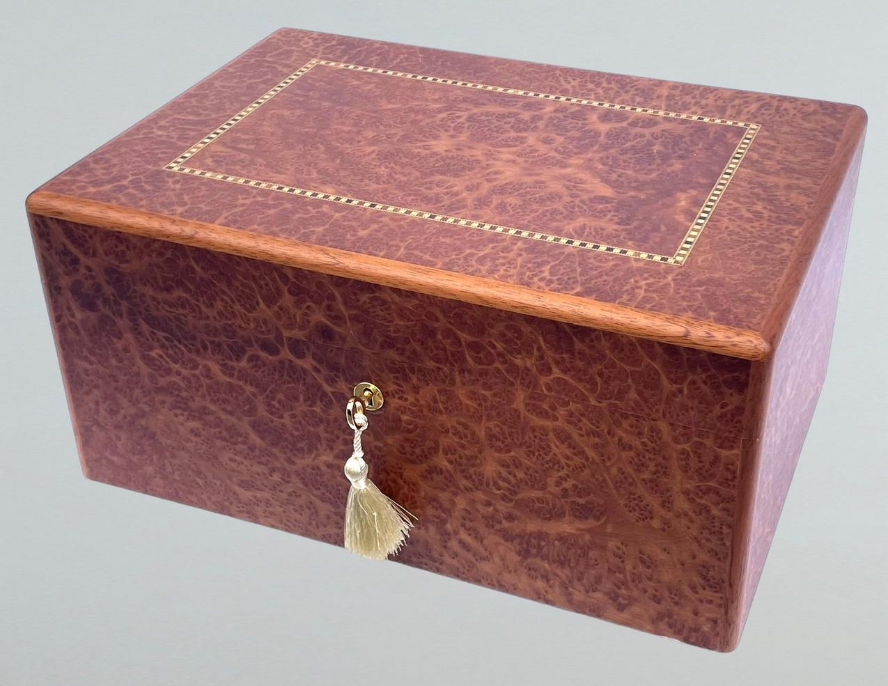 This Vavona Wooden Jewelry Casket was manufactured by the Famed Manning of Ireland Company and is truly a Jewel of handcrafted genius. This box is constructed of the finest woods available and the knowledge and skill of 4 generations of box making