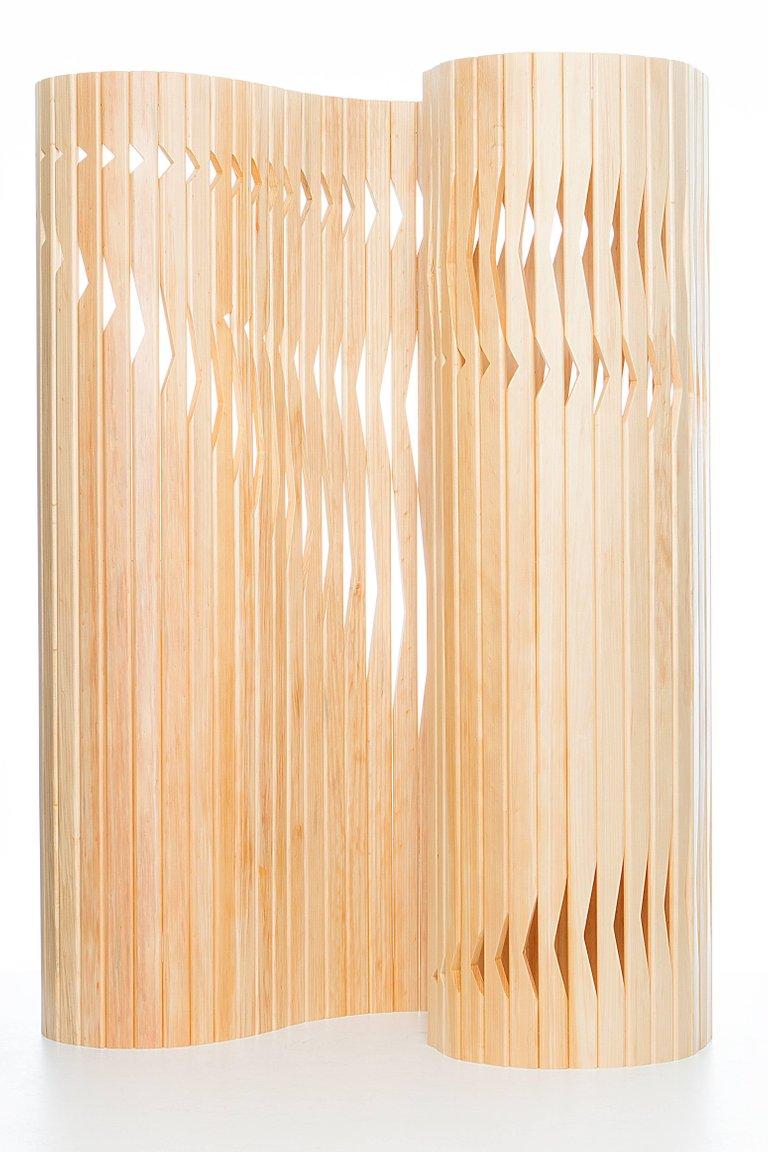 Designed by Andrea Macruz, the V.az is a contemporary partition made of pinewood. Created in 2016.

The v.az is made of pinewood strips cut in a CNC and connected by four steel cables carefully distributed at different heights.

V.az is a