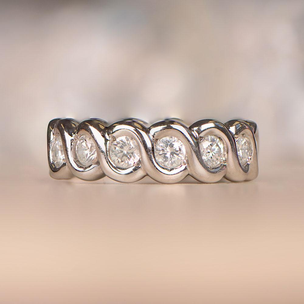Van Cleef & Arpels round brilliant-cut diamond eternity band with a gold swivel design.

Ring Size: 6.5 US, Resizable
Signed: VCA
Color: D - F Color
Clarity: VS1 Overall
Metal: Gold, White Gold
Stone: Diamond
Stone Cut: Round Brilliant Cut
Style: