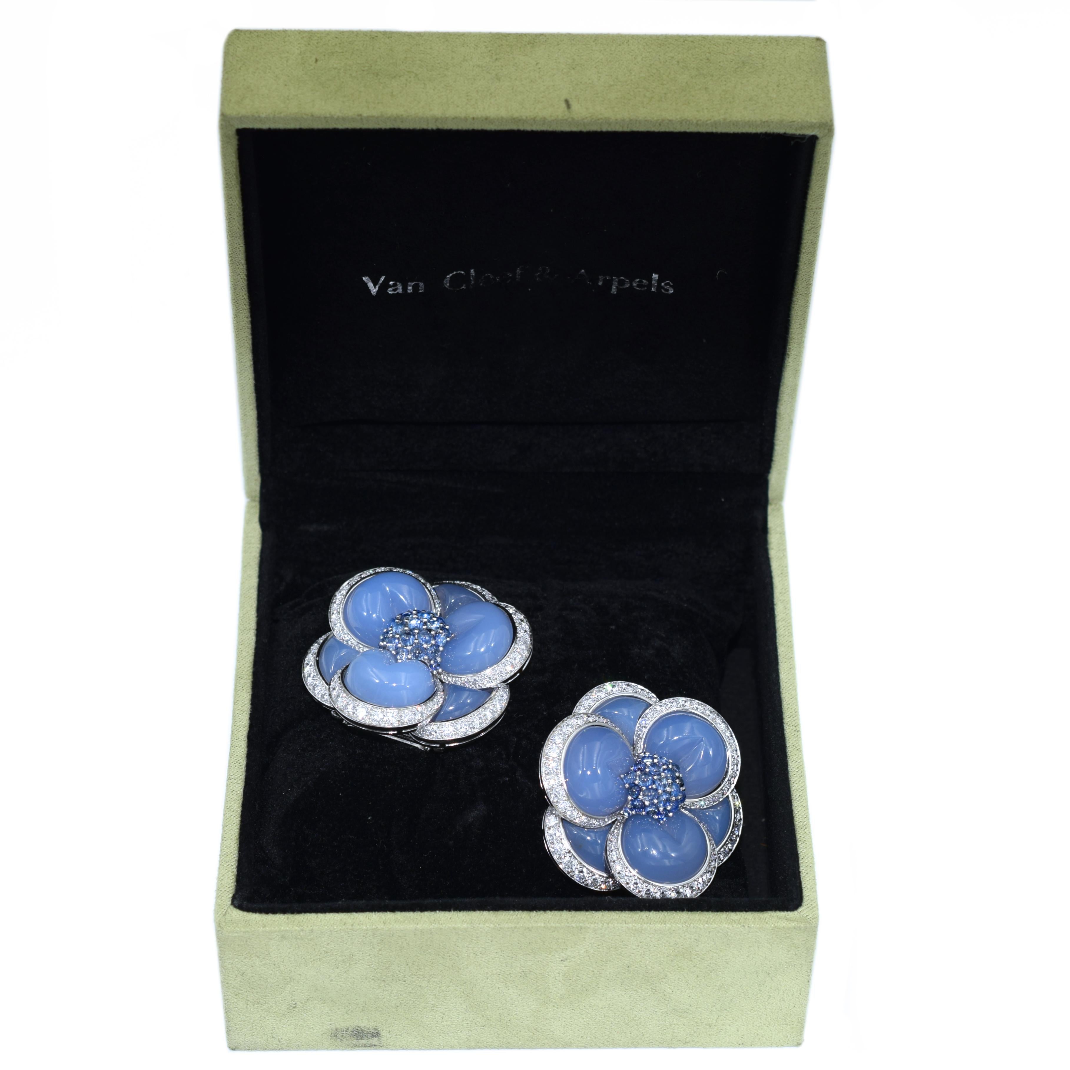 Pair of VCA chalcedony, sapphire and diamond 'Blue Gardenia' clip brooches. The brooches feature
chalcedony petals with edges adorned by 144 round brilliant cut diamonds, weighing total of
approximately 3.50ct - 4.0ct, color F-G, clarity VVS-VS.