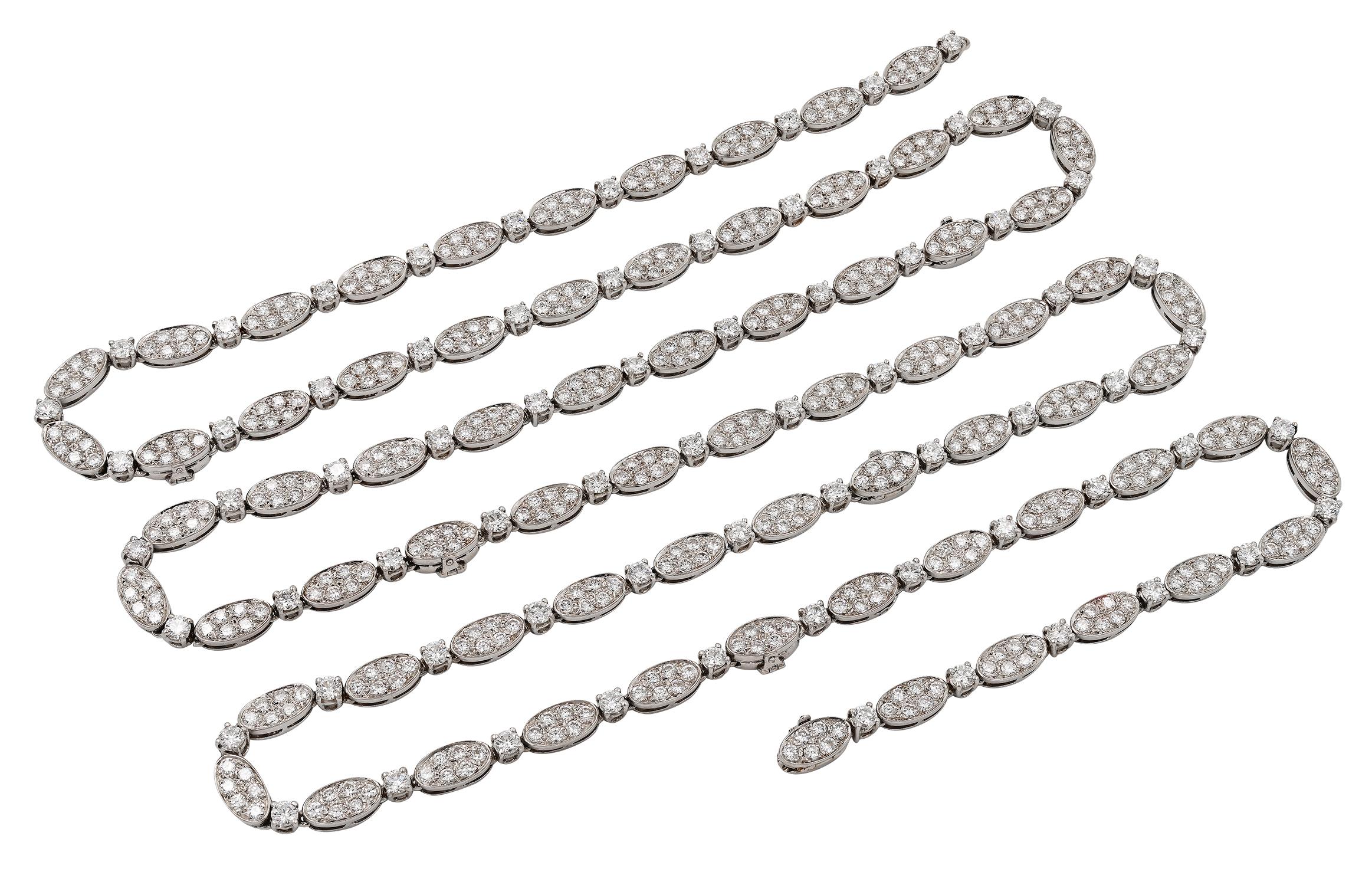 VAN CLEEF NECKLACE.

A magnificent example of elegance and sophistication from the renowned Paris Jewler Van Cleef and Arpels .

This opera length necklace is intricately set with approximately 30 carats of ideal cut round colorless diamonds.
The