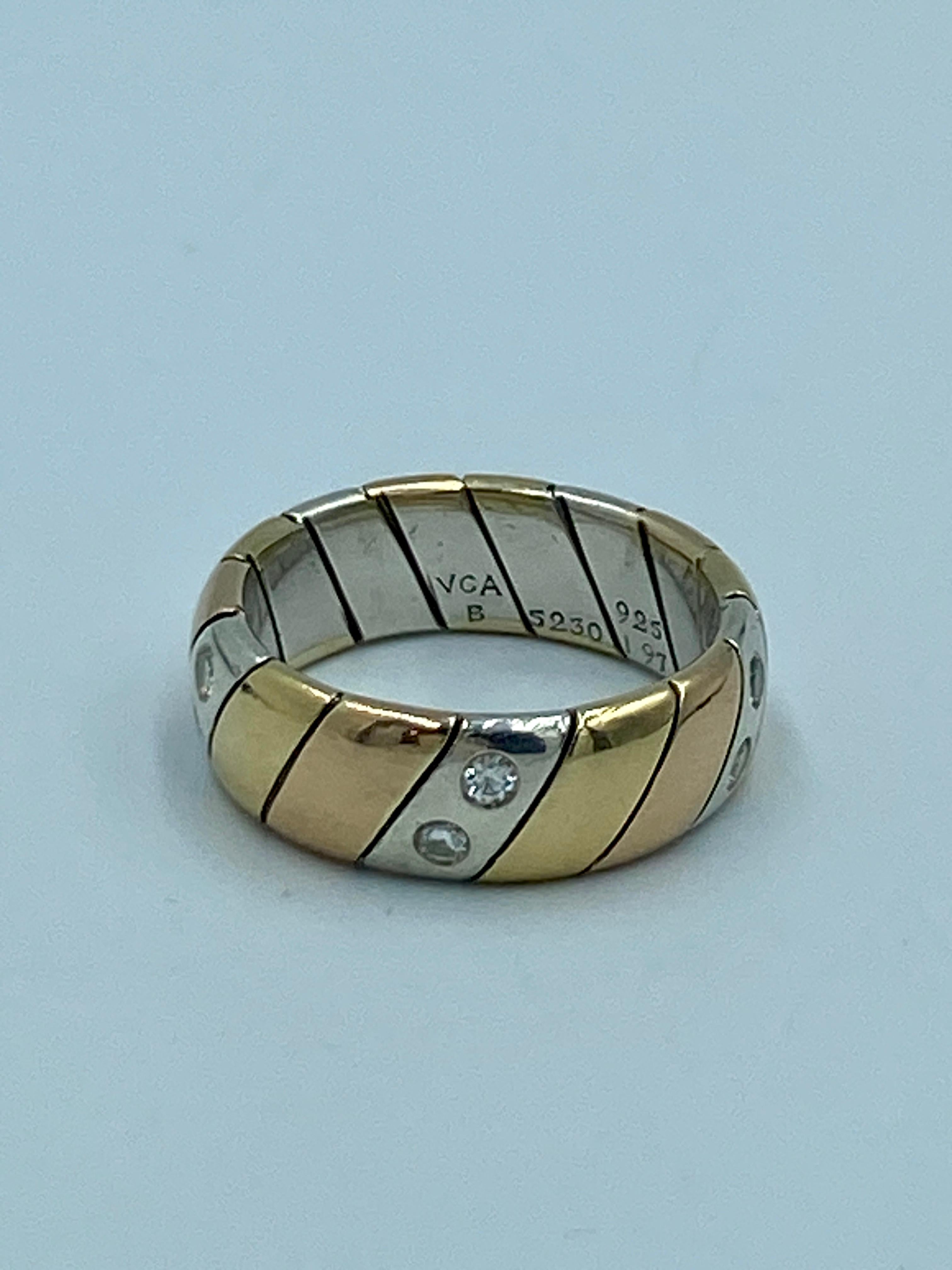 This 1960s VCA engagement ring is made of silver, rose gold and yellow gold. The silver pieces are set with round cut diamonds weighing a total of approximately 0.5 carats. The ring is 7 mm in width.