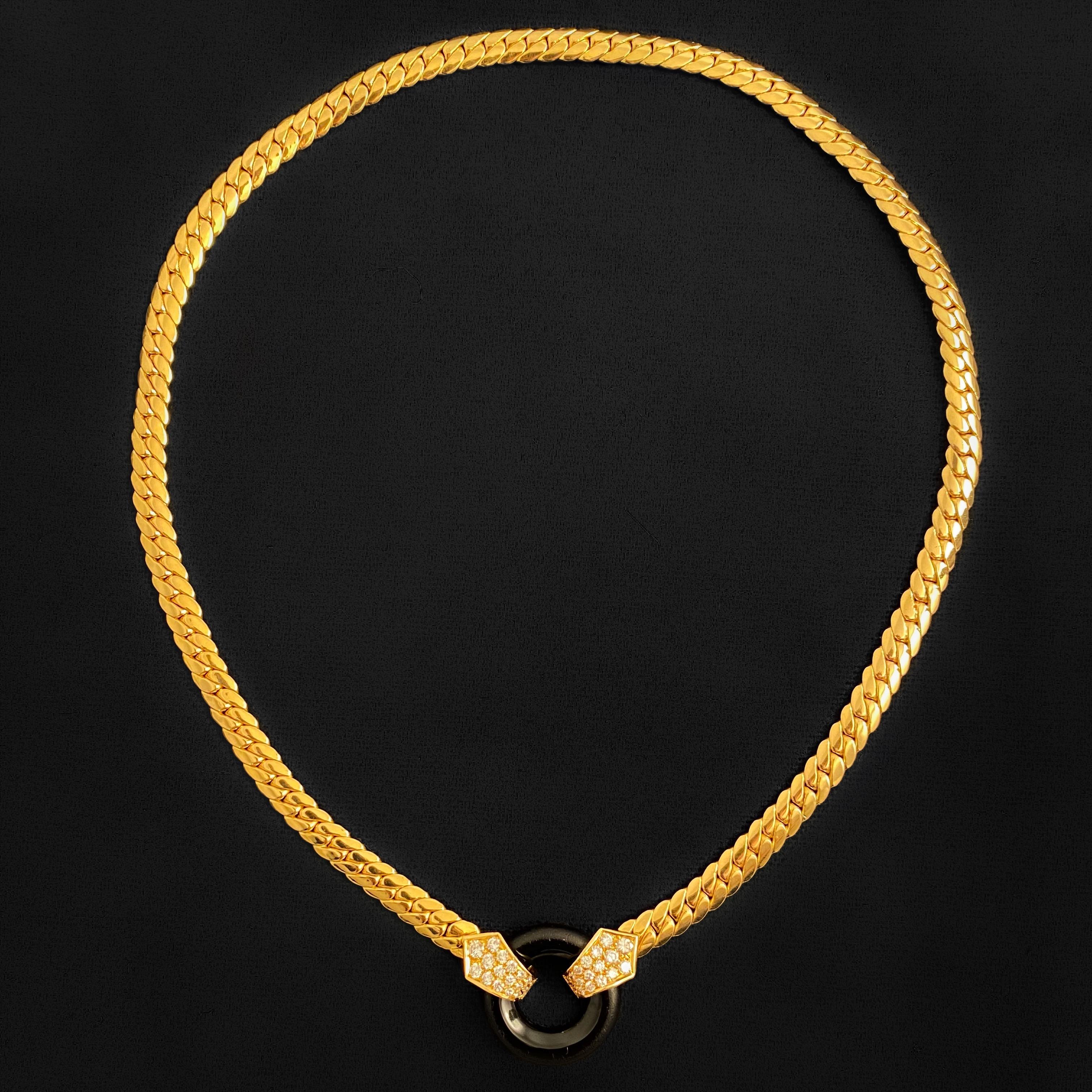 VCA Van Cleef & Arpels Vintage Onyx and Diamond Necklace in 18 Karat Yellow Gold, France, 1980s (circa 1988). The articulated flat curb link chain in polished yellow gold leads to shield shape terminals on both ends, each of them pave-set with round