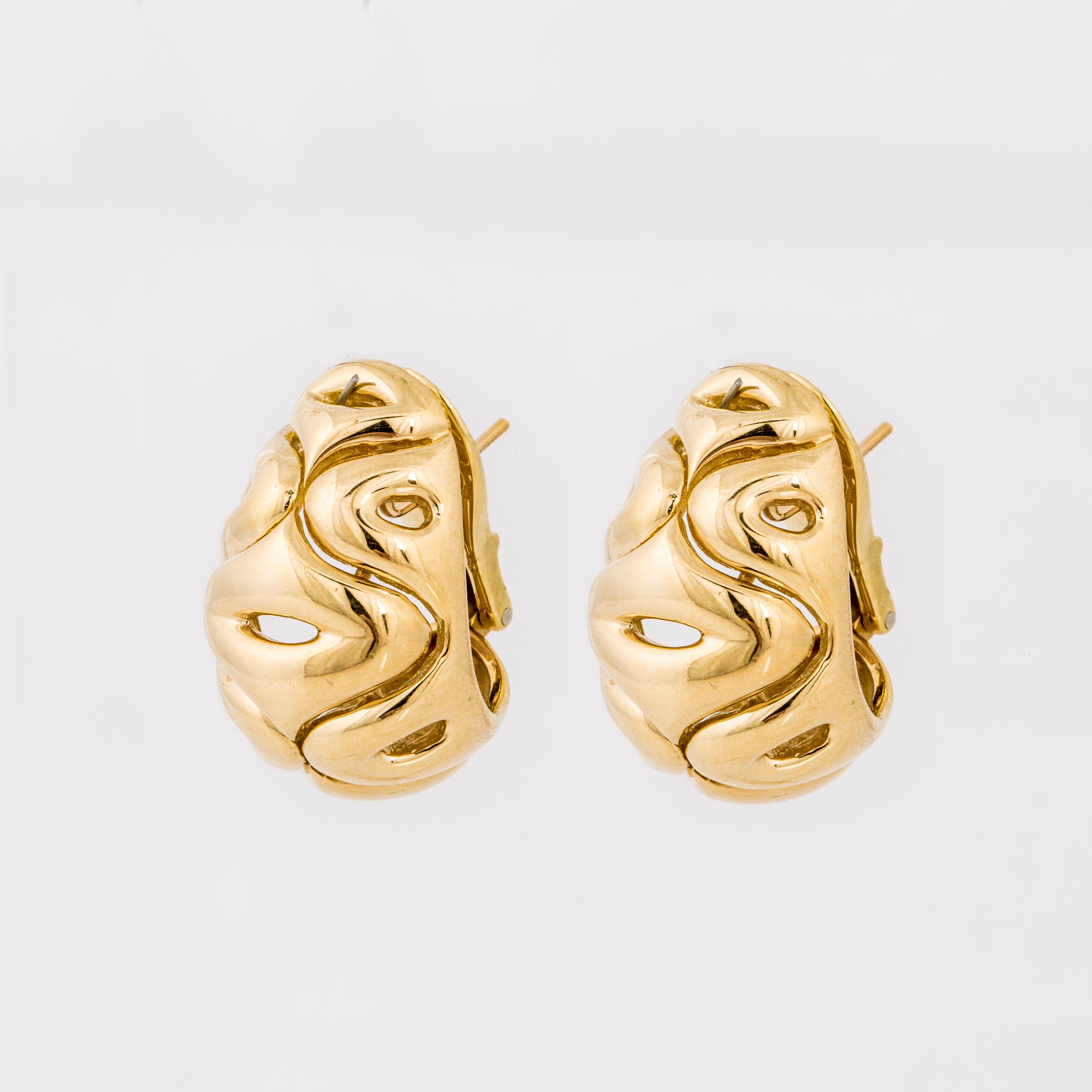 Van Cleef & Arpels earrings in 18K yellow gold with a swirl pattern. These are for pierced ears with a lever back.  Measure 1 inch long and 3/4 inches wide.  Serial No. NY3K750-10.