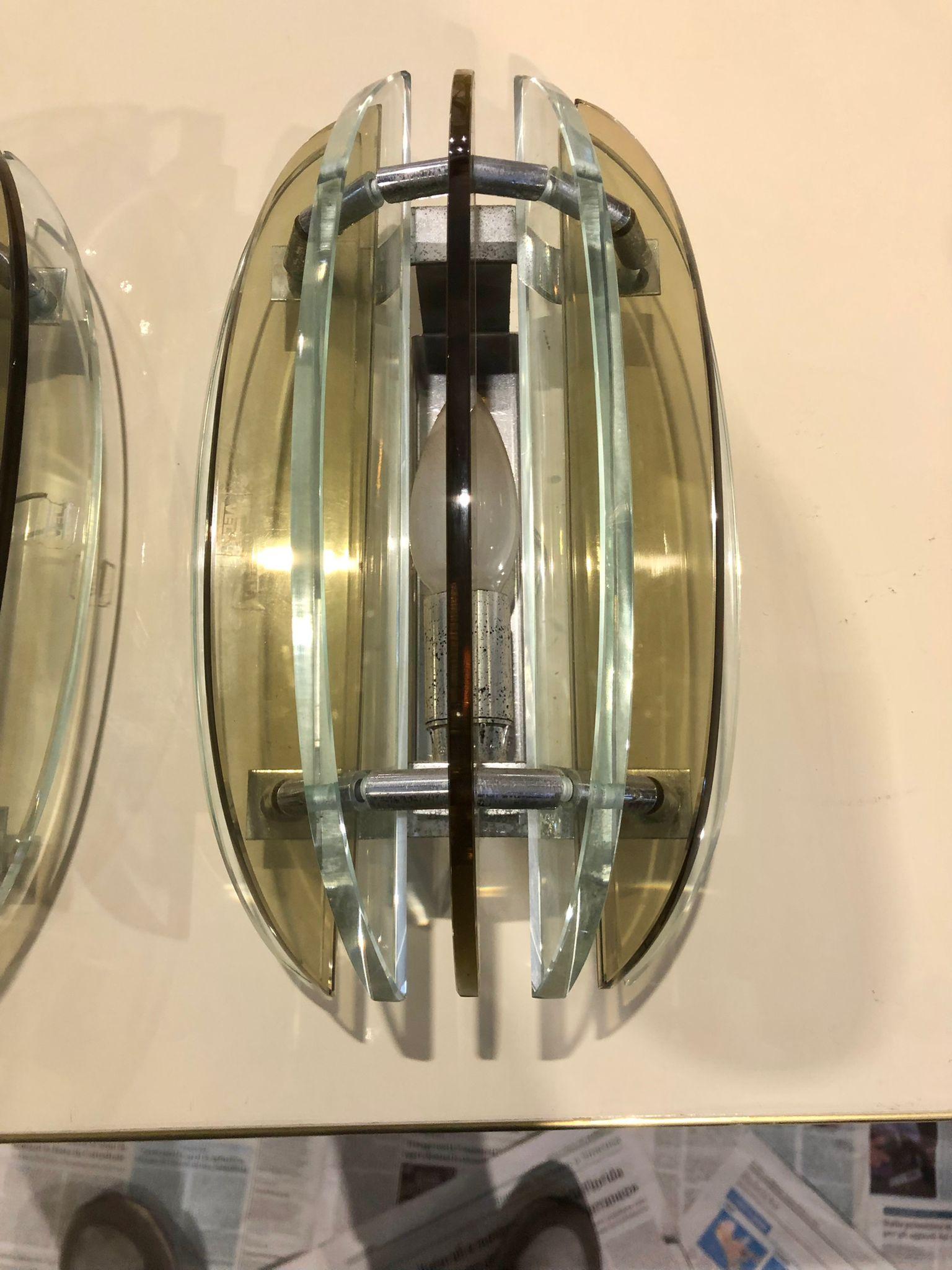 Veca was an Italian important company active in the 1960s and 1970s specialized in the production of glass lighting and mirrors made out of flat rolled glass.