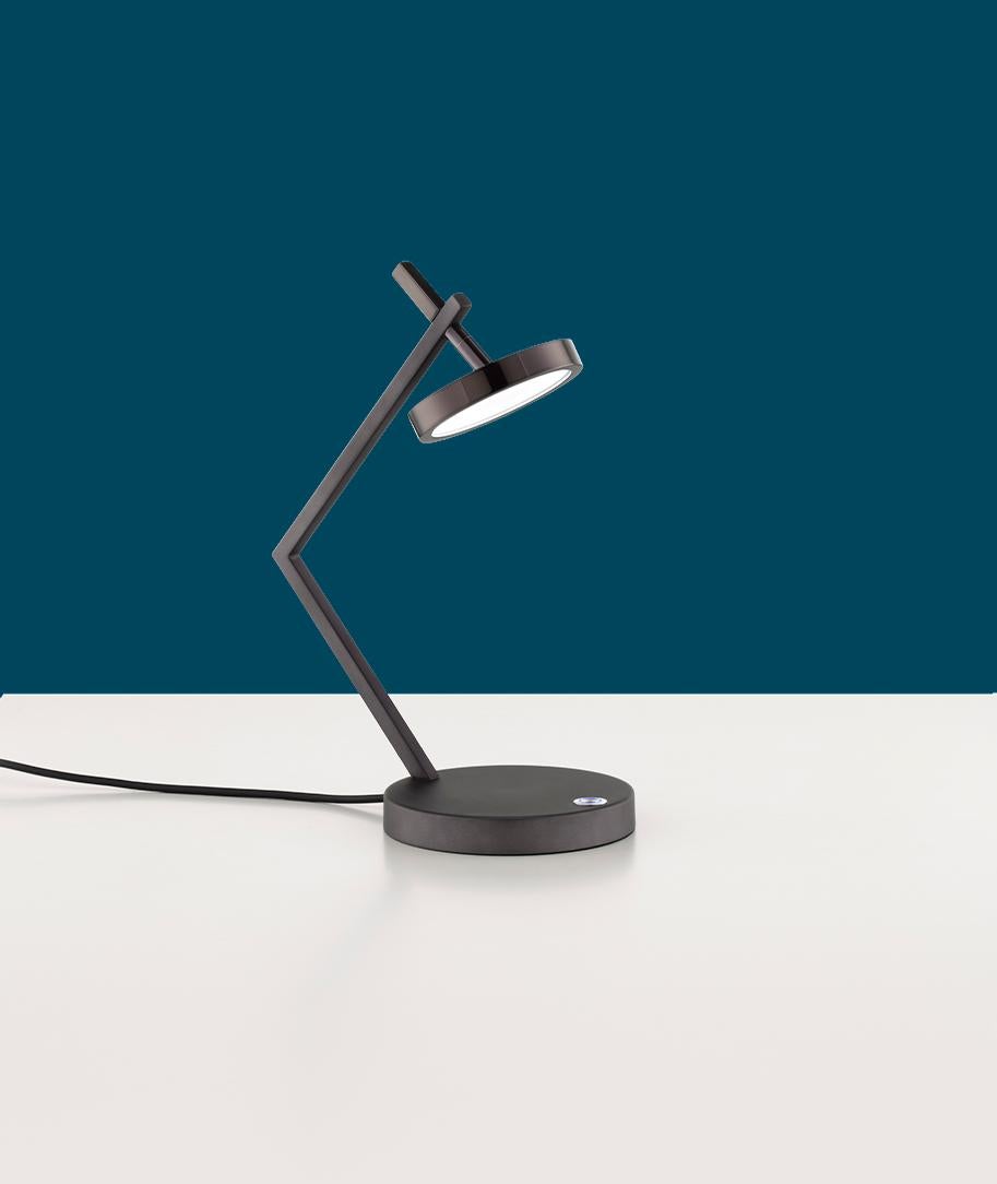 Vector Table Lamp by Euroluce Lampadari
Dimensions: D 16 x W 28 x H 36 cm.
Materials: Metal and glass.

Available in different colors. Prices may vary. All our lamps can be wired according to each country. If sold to the USA it will be wired for the