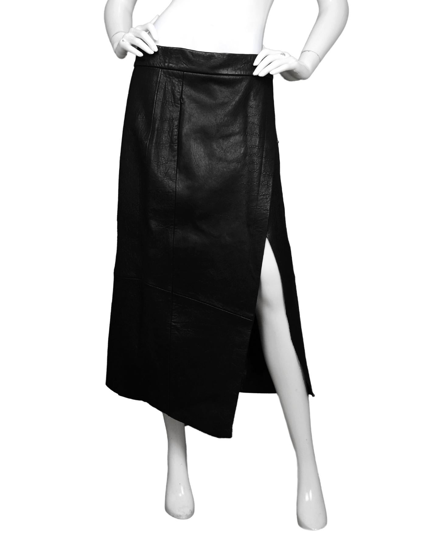 Veda Black Leather Crosby Midi Wrap Skirt Sz L

Made In: China
Color: Black
Materials: 100% lamb leather 
Lining: 100% polyester
Closure/Opening: Snap wrap front
Overall Condition: Excellent condition with original tags attached
Estimated Retail: