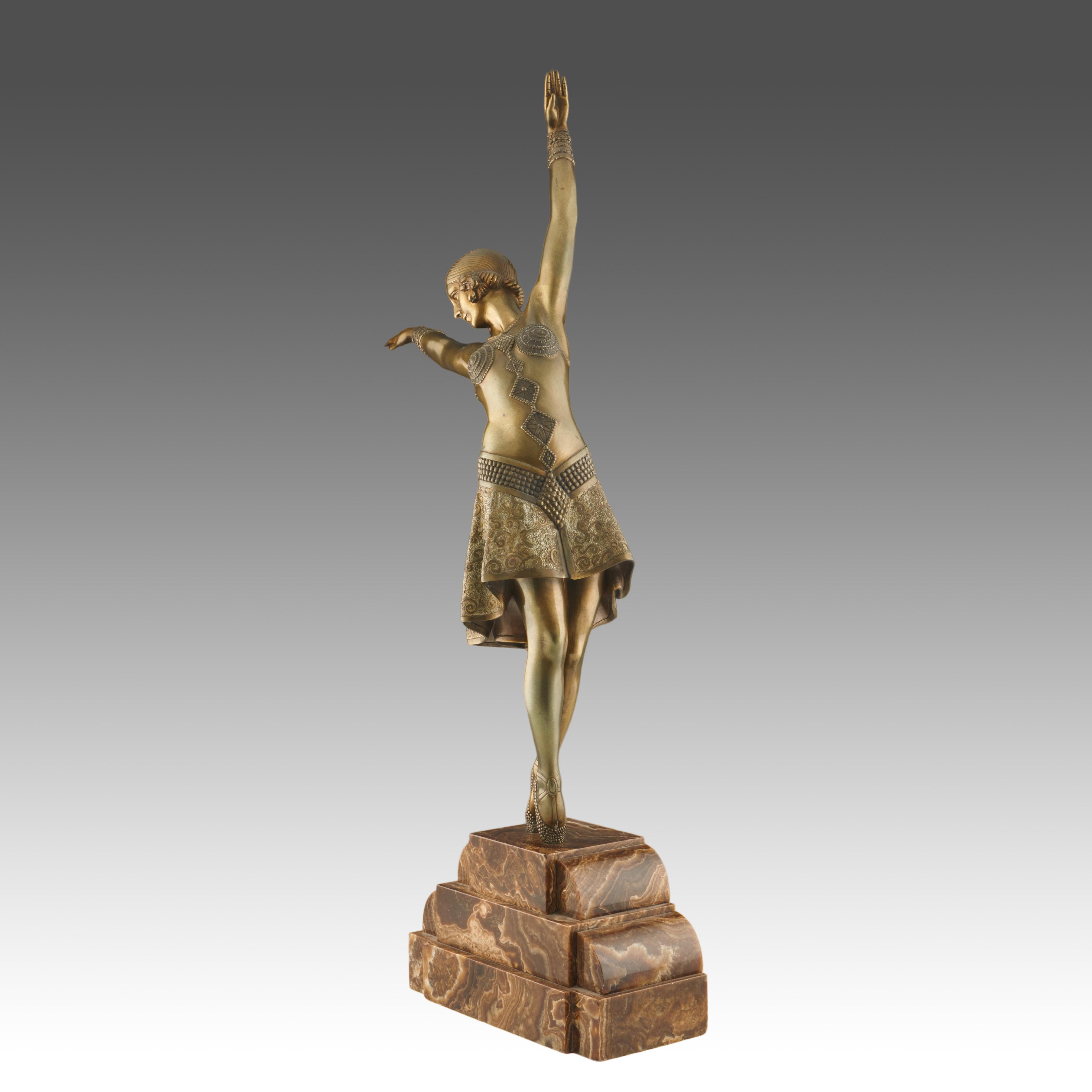 Vedette' an Art Deco cold painted gilt bronze figure by Demetre Chiparus (1886-1947). An energetic dancer dressed in scantily clad theatrical costume with arms outstretched in a stylised pose. Excellent hand finished detail and fine colour. Raised