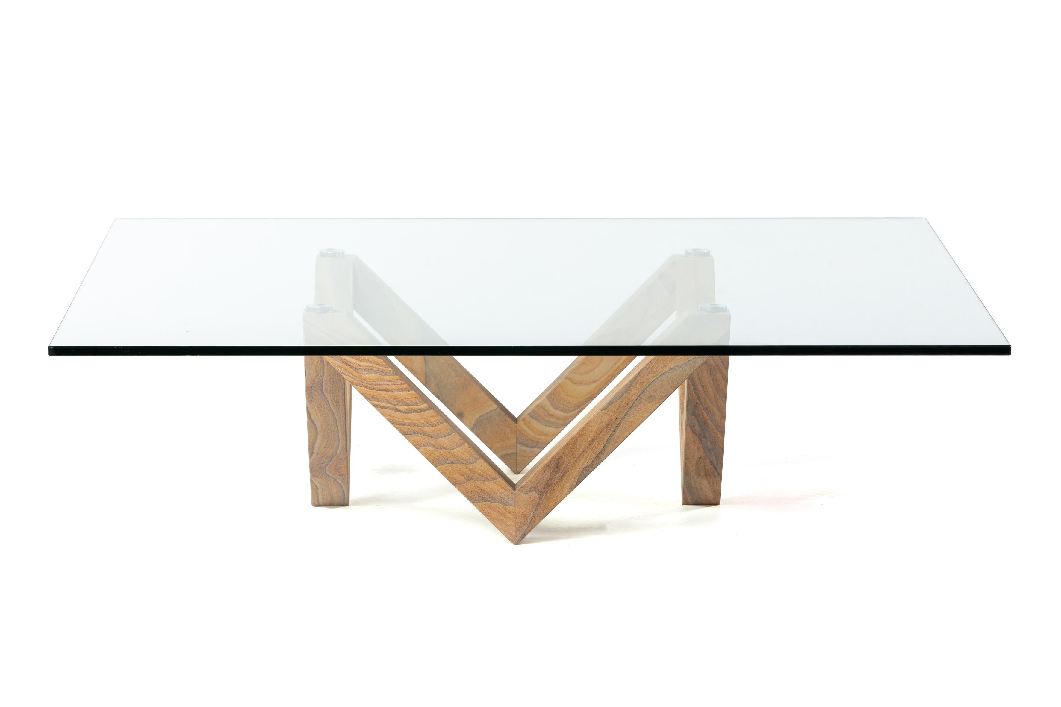 Vega coffee is a coffee table consisting of a marble structure together with a glass top. It also has small polished metal sconces between the stone and marble.
The Indian wood limestone marble structure in this Vega table is completely symmetrical