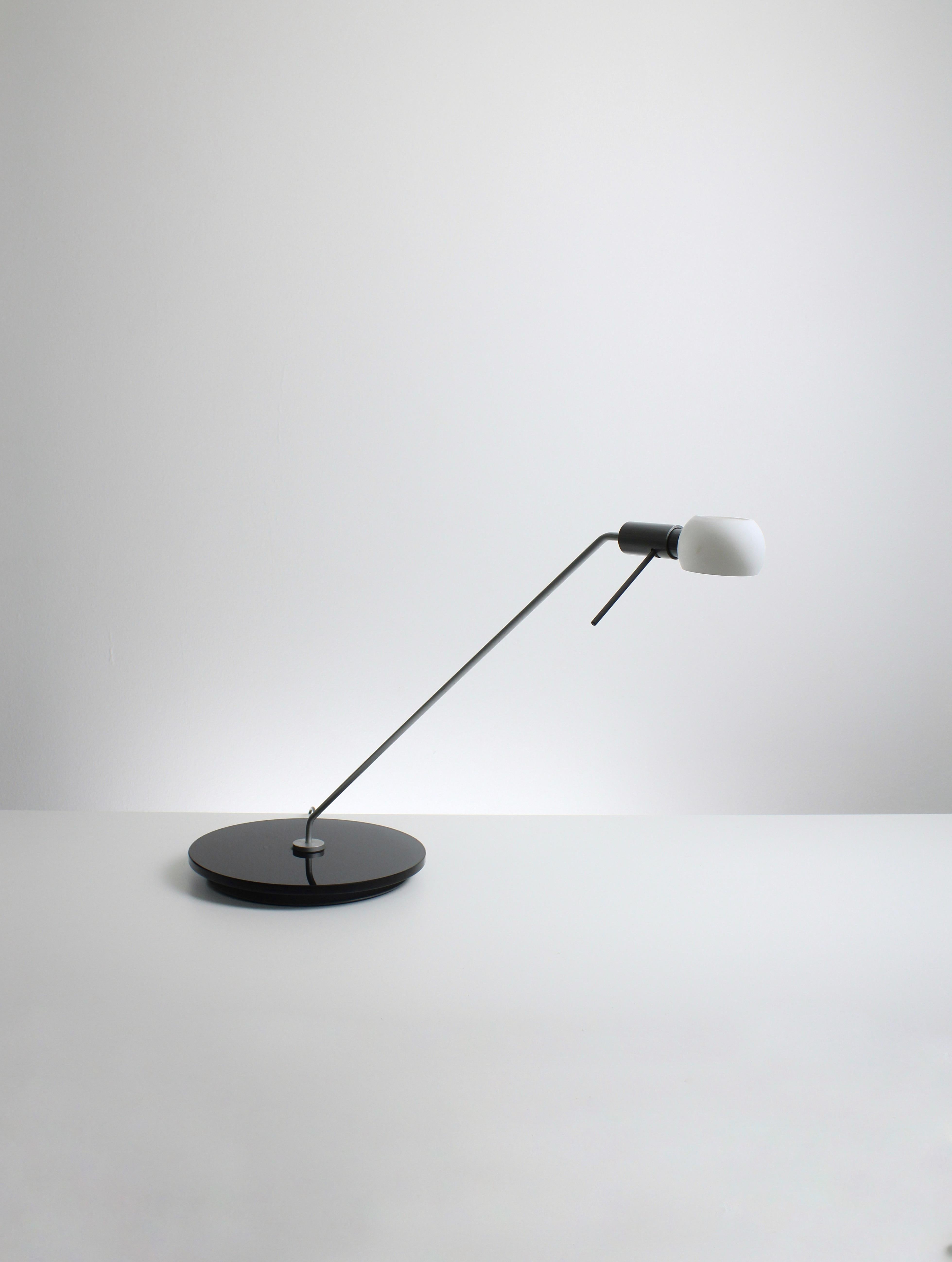 Vega desk lamp, produced by Fontana Arte in the 1980s. This is one of the less-known lamps that Michele De Lucchi designed. At the beginning of his career, Michele worked for Artemide and Memphis. During that time, he designed the Toledo desk lamp.