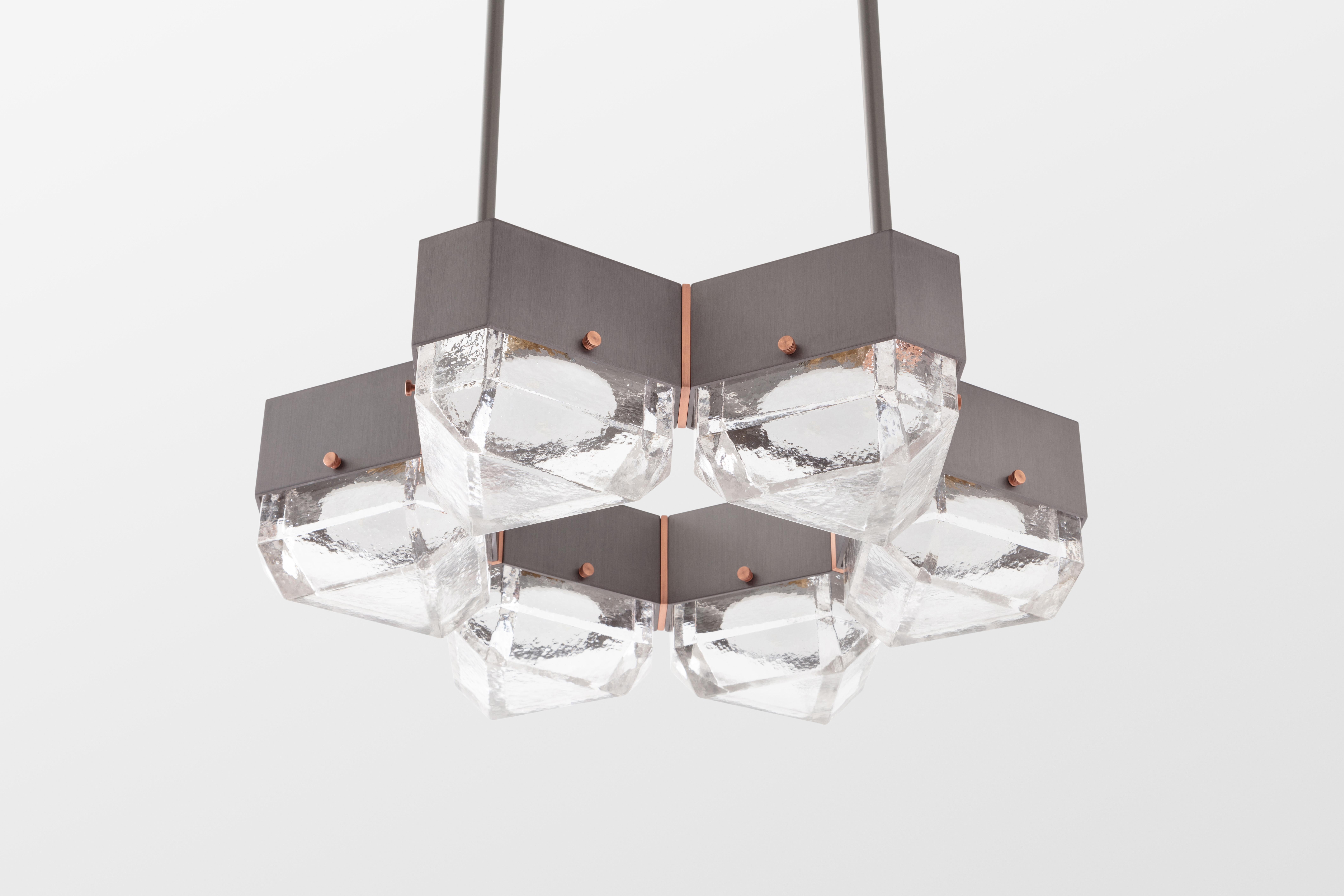 Vega is a geometric, modular, contemporary lighting fixture. The body is made from extruded aluminum with brass accents. The diffusers are available in cast glass. No external driver is necessary since Vega is outfitted with fully dimmable, warm