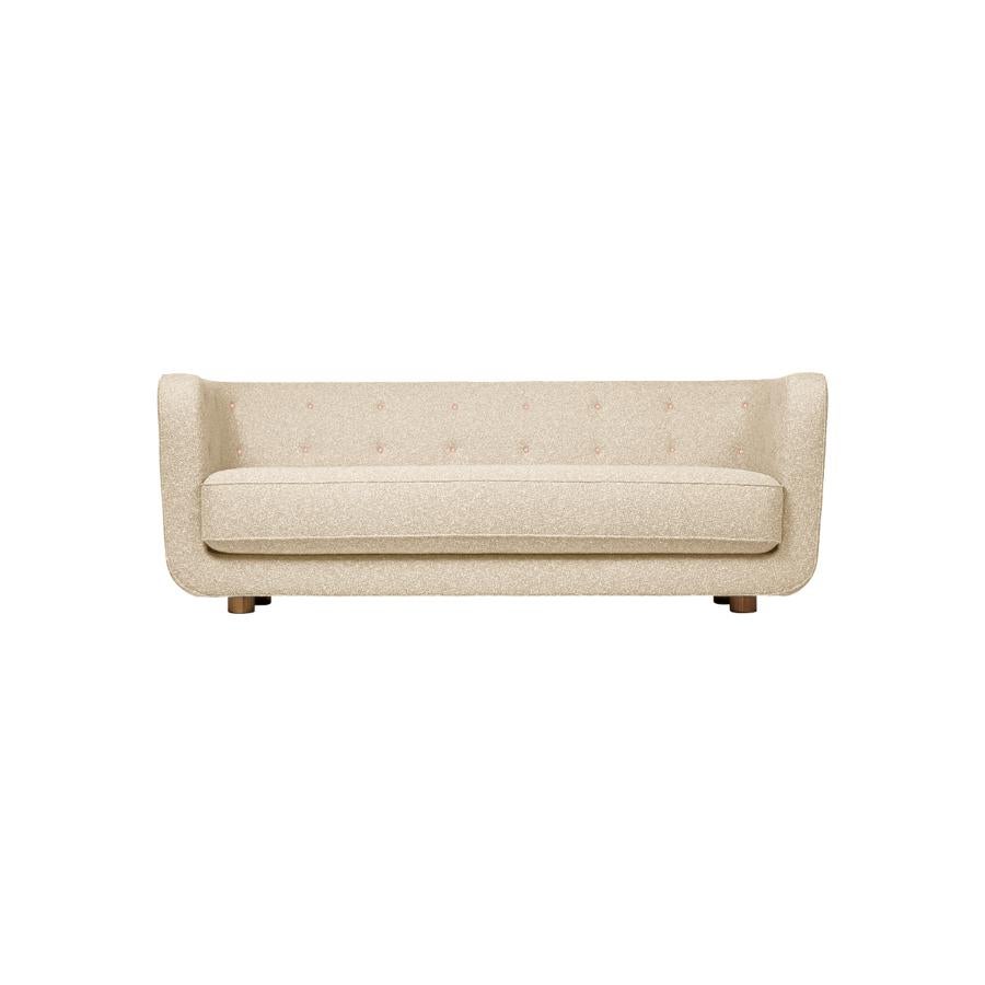 Vegeta buttons and smoked oak Signatur model Vilhelm sofa by Lassen
Dimensions: W 217 x D 88 x H 80 cm 
Materials: Textile, Oak.

Vilhelm is a beautiful padded three-seater sofa designed by Flemming Lassen in 1935. A sofa must be able to