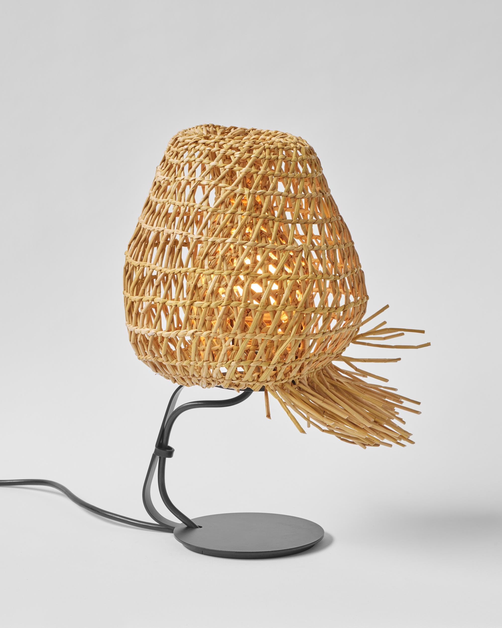 Vegetable Fabrics N°6 Nest lamp by Estudio Rafael Freyre
Dimensions: D 30 x H 40 cm 
Materials: Reed, metal.

Vegetable Fabrics brings us closer to the processes of growth and transformation of the plant organism, posing a relationship with them