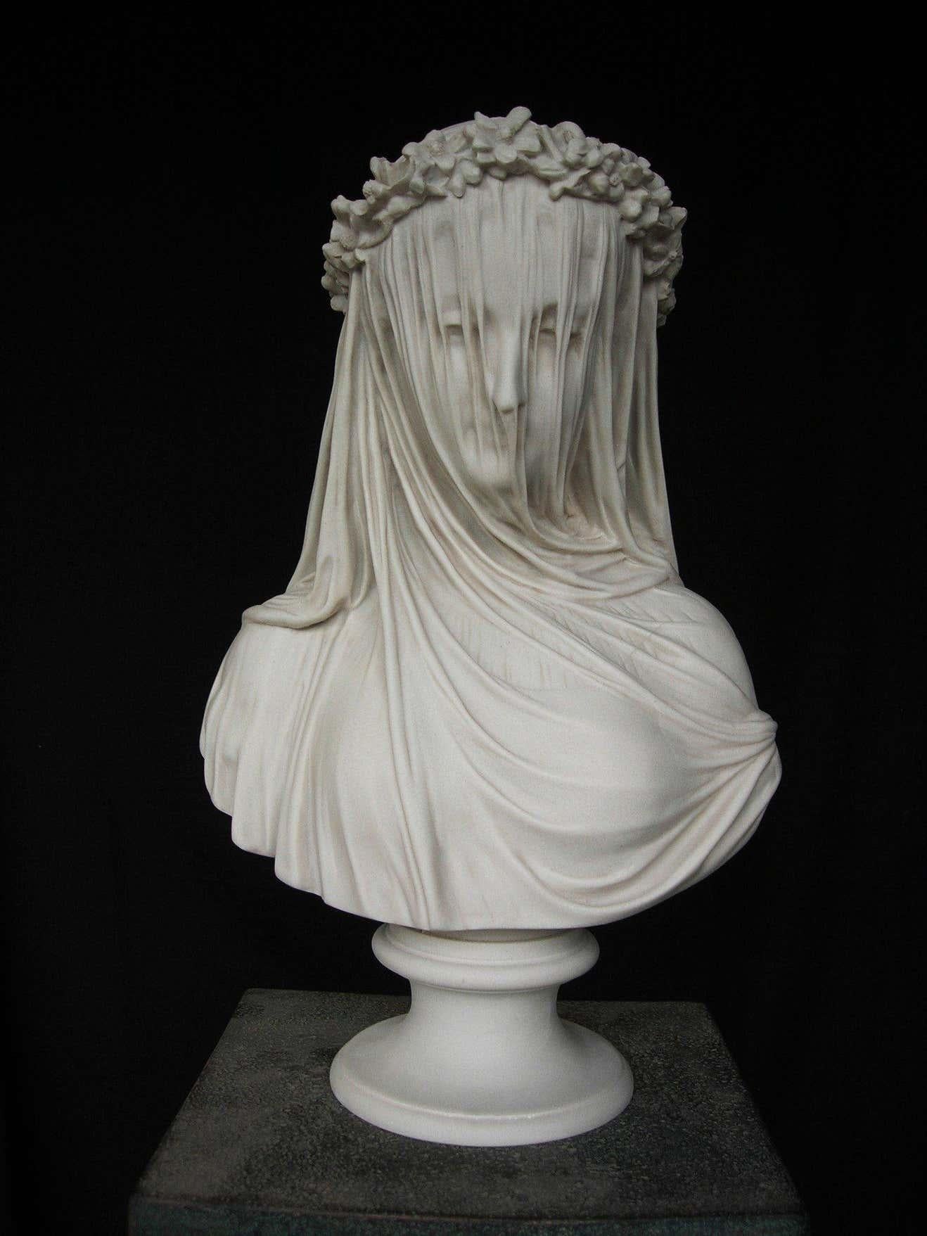 The Veiled Lady a bust, after the antique by Monti, 1875.
Also known as the bride, this sculpture was created by the Italian sculptor Raphaelle Monti, who came to live and work in England, 1850. He established his name with the Veiled Lady