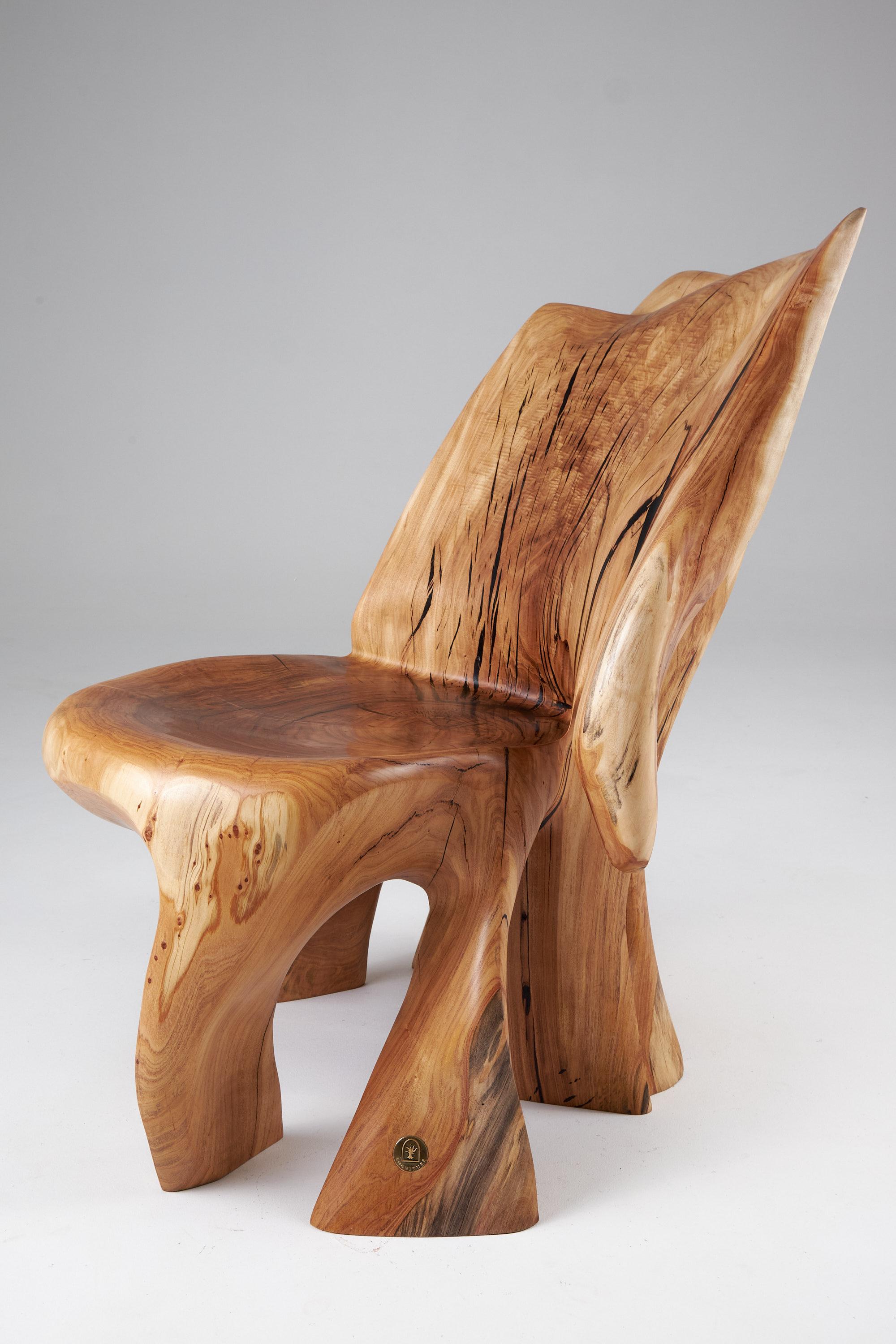 single wooden chair with arms