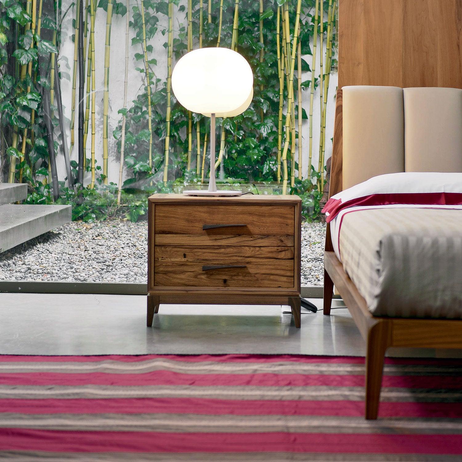 Velo Bedside Table by Dale Italia
Dimensions: D 42 x W 60 x H 50 cm.
Materials: Walnut.

The frame is made of walnut veneer blockboard with solid edging. Available in two different sizes and two finishes: natural and grey walnut. Prices may vary.