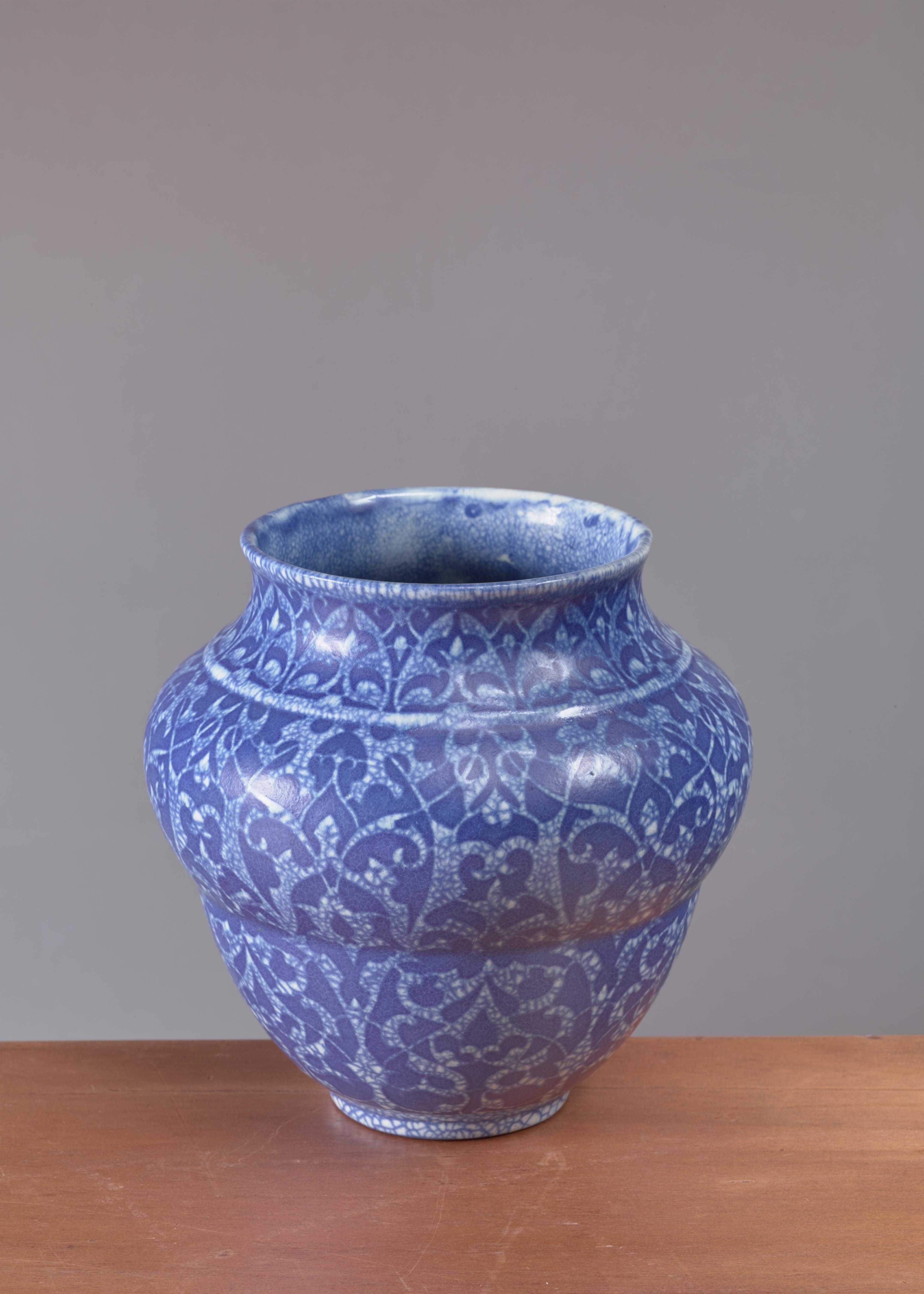 An Art Deco crackle glaze vase with a blue pattern by Velten Vordamm, Germany, 1920s.

Marked: “Vordamm” and additional text (possibly “A/14”).
