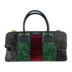 Bolso de terciopelo y piel azul oscuro