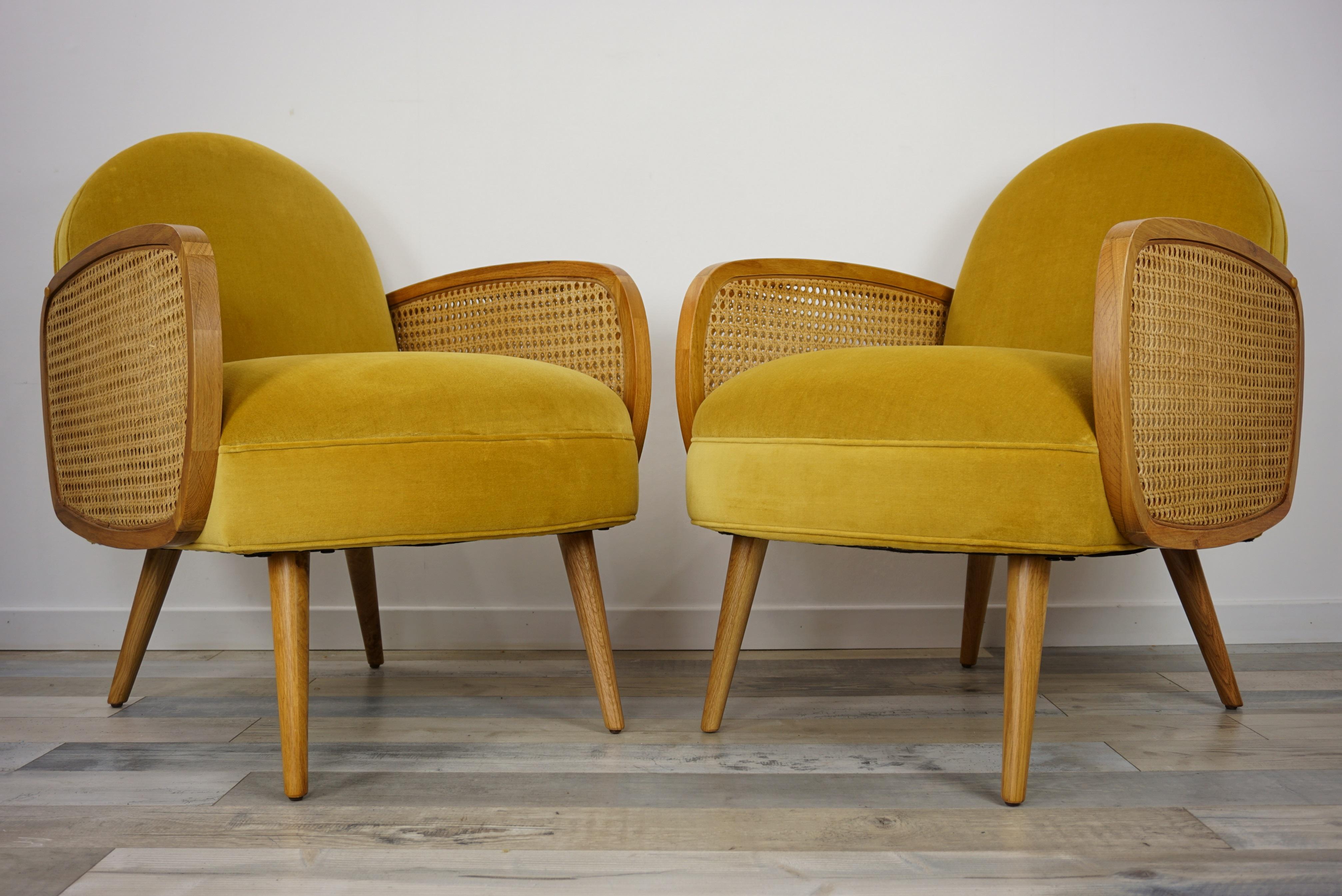 French design and midcentury style mustard velvet and oak wooden lounge armchairs with welcoming shape, cane armrests, compass wooden feet... Elegant, trendy colors and comfortable!