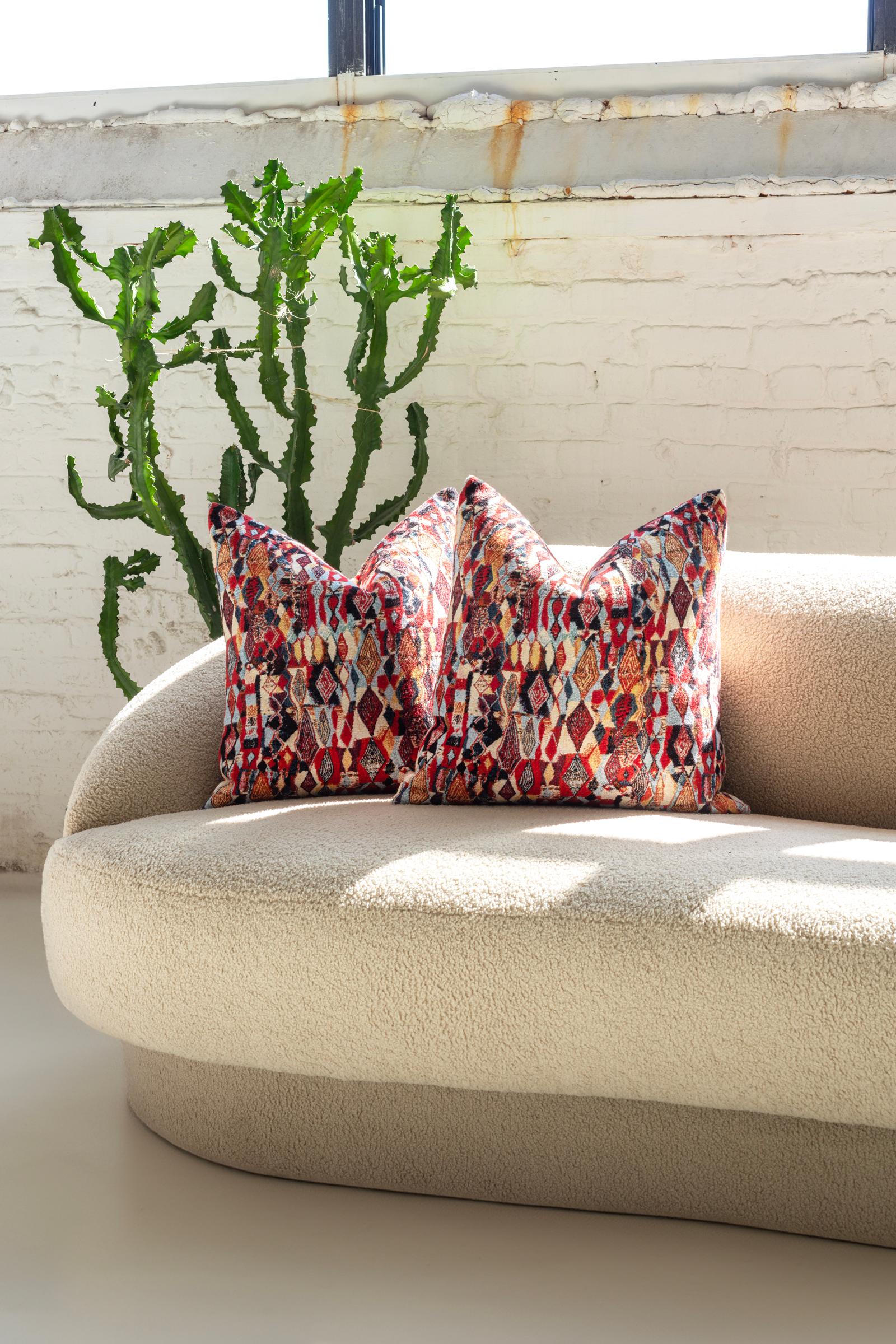 Crafted with unmatched skill in Chicago, these throw pillows embody luxury and artisanal beauty. Inside, the plush down filling provides supreme comfort, making them the perfect companions for relaxation. The exterior is where they truly