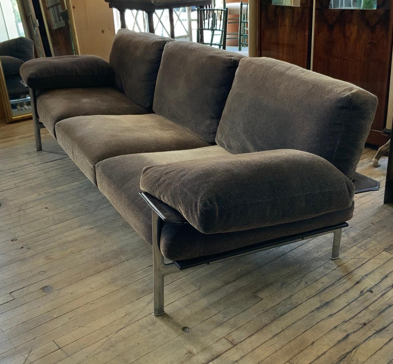 An outrageously comfortable and stylish 1990s Diesis sofa designed by Antonio Citterio and made in Italy by B&B Italia. With a polished stainless steel frame, wrapped with saddle leather, and the cushions upholstered in a brown velvet with hints of