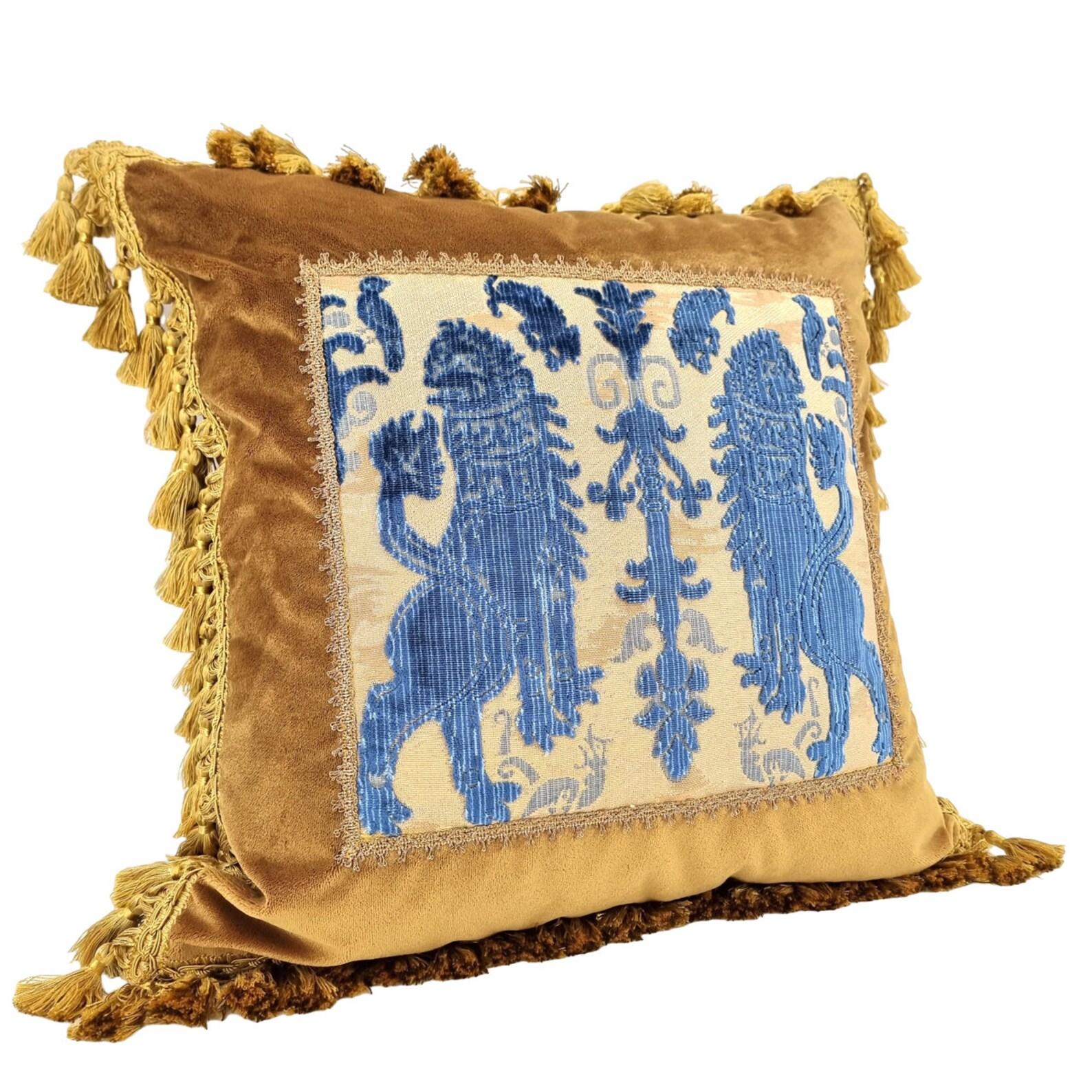 This amazing decorative pillow with gold tassel trim all around the four edges is handmade using Rubelli velvet in antique gold color embellished with front positioned panel in Luigi Bevilacqua indigo blue silk heddle velvet 