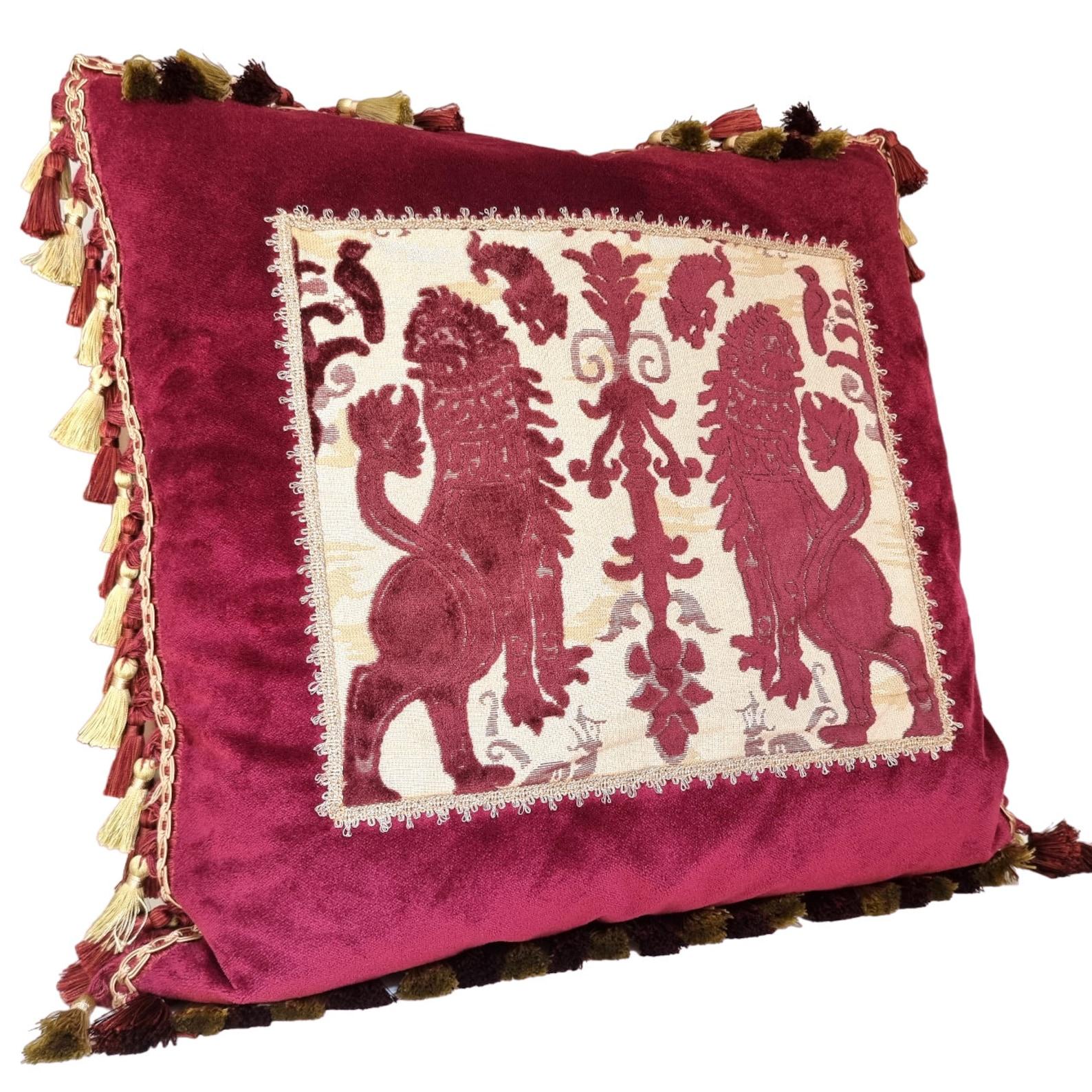 This amazing decorative pillow with red and gold tassel trim all around the four edges is handmade using Rubelli velvet in red color embellished with front positioned panel in Luigi Bevilacqua burgundy red silk heddle velvet 
